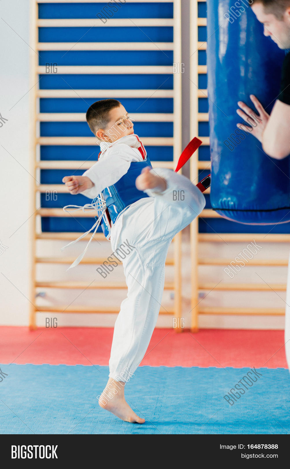 child kicking punching bag on 164878388 image stock photo 164878388 https istockphoto 7eer net c 1327686 414531 4205 u https www istockphoto com plans and pricing