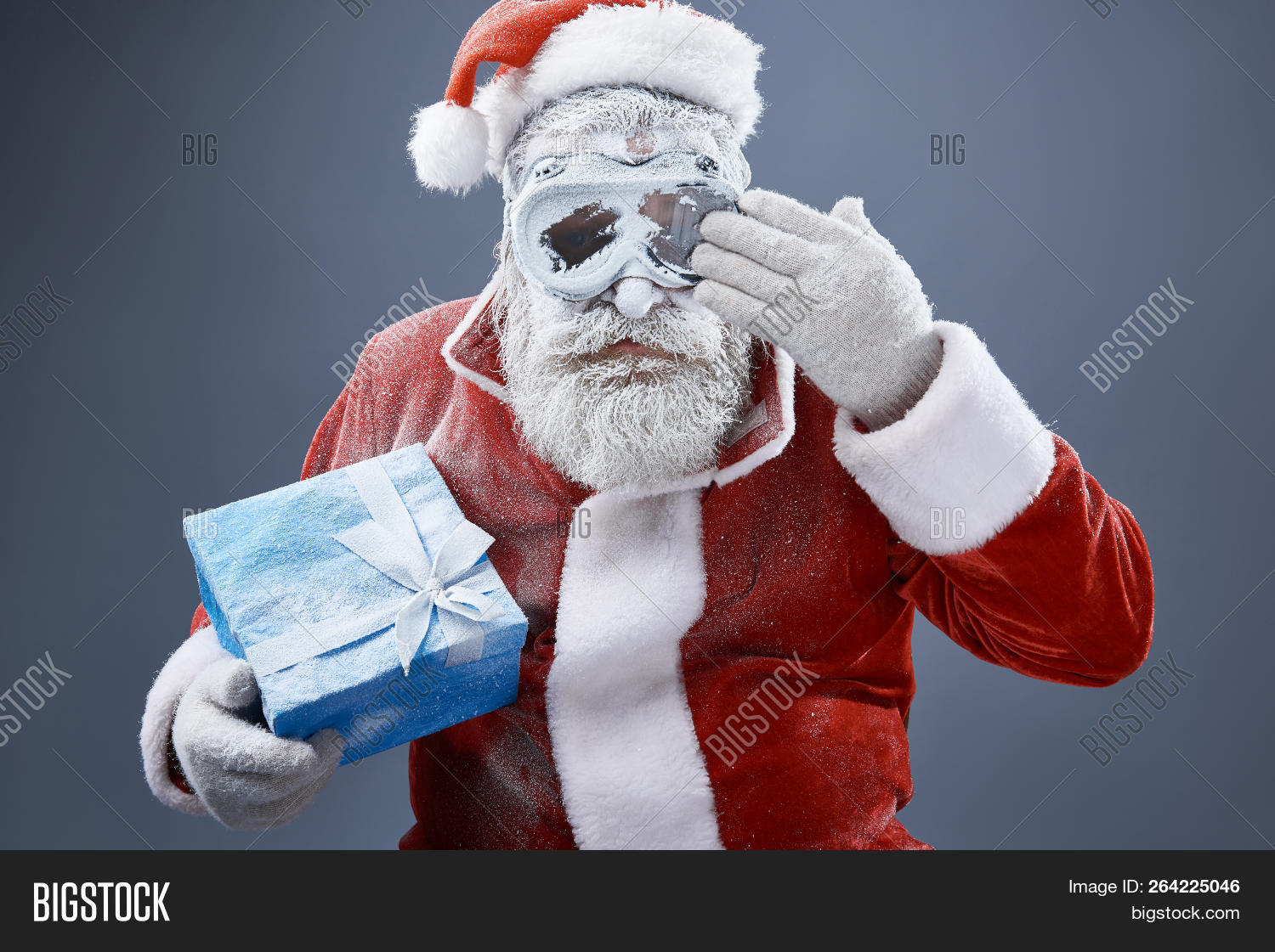 arctic,background,beard,blizzard,blue,bow,box,celebration,christmas,claus,clean,cold,costume,covered,elderly,eve,freeze,frost,frozen,gentleman,gift,glasses,gloves,goggles,gray,hand,hat,holiday,isolated,male,man,mature,merry,old,person,portrait,present,protective,red,remove,ribbon,santa,snow,studio,tradition,up,waist,white,winter,xmas