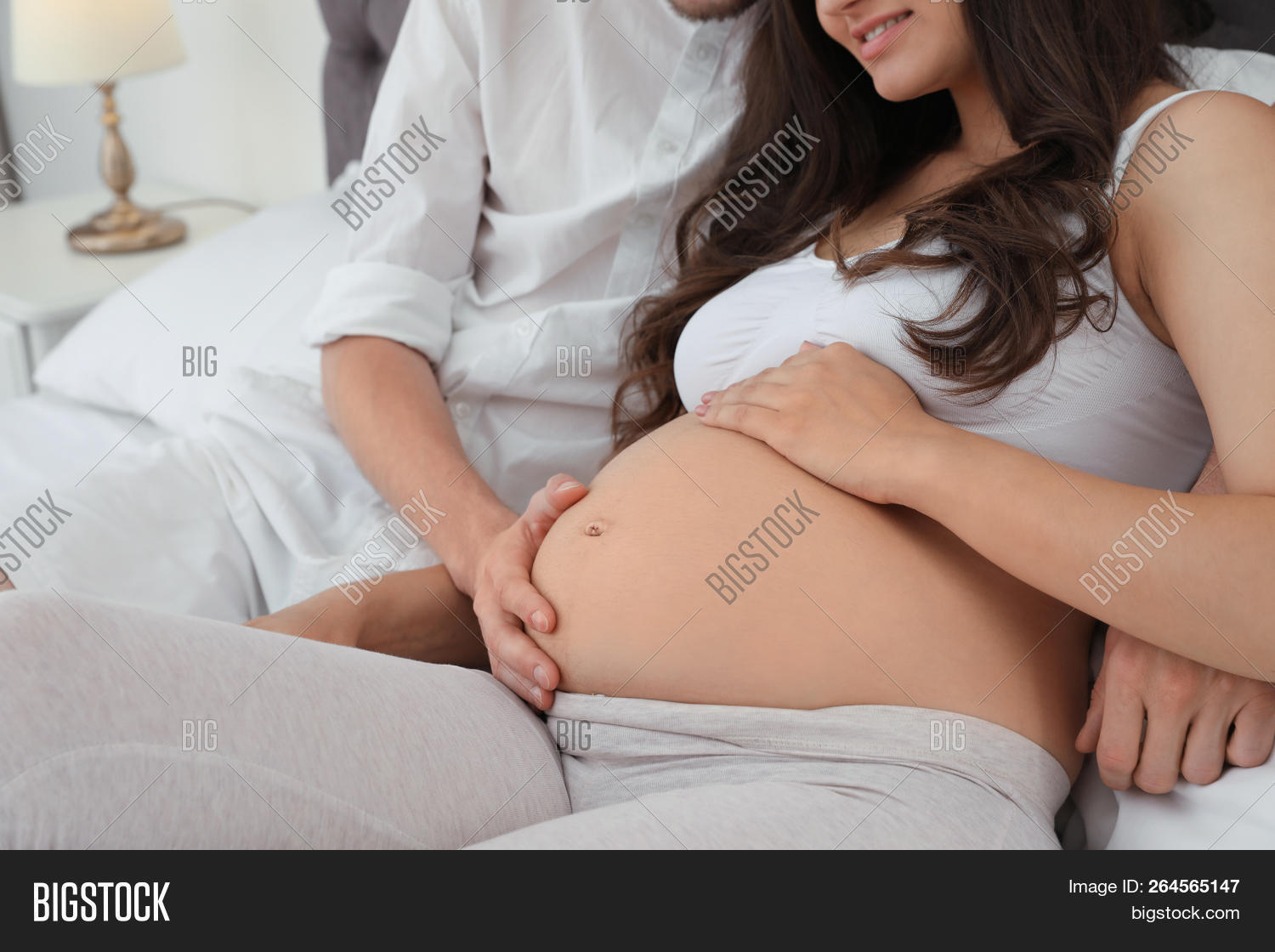 abdomen,adult,anticipation,baby,beautiful,bed,bedroom,belly,birth,care,child,closeup,couple,dad,expecting,expression,family,father,female,hands,happiness,happy,home,husband,indoors,look,love,lying,male,man,maternity,mom,mother,motherhood,parents,people,pregnancy,pregnant,spending,support,time,together,touch,touching,tummy,wife,woman,young