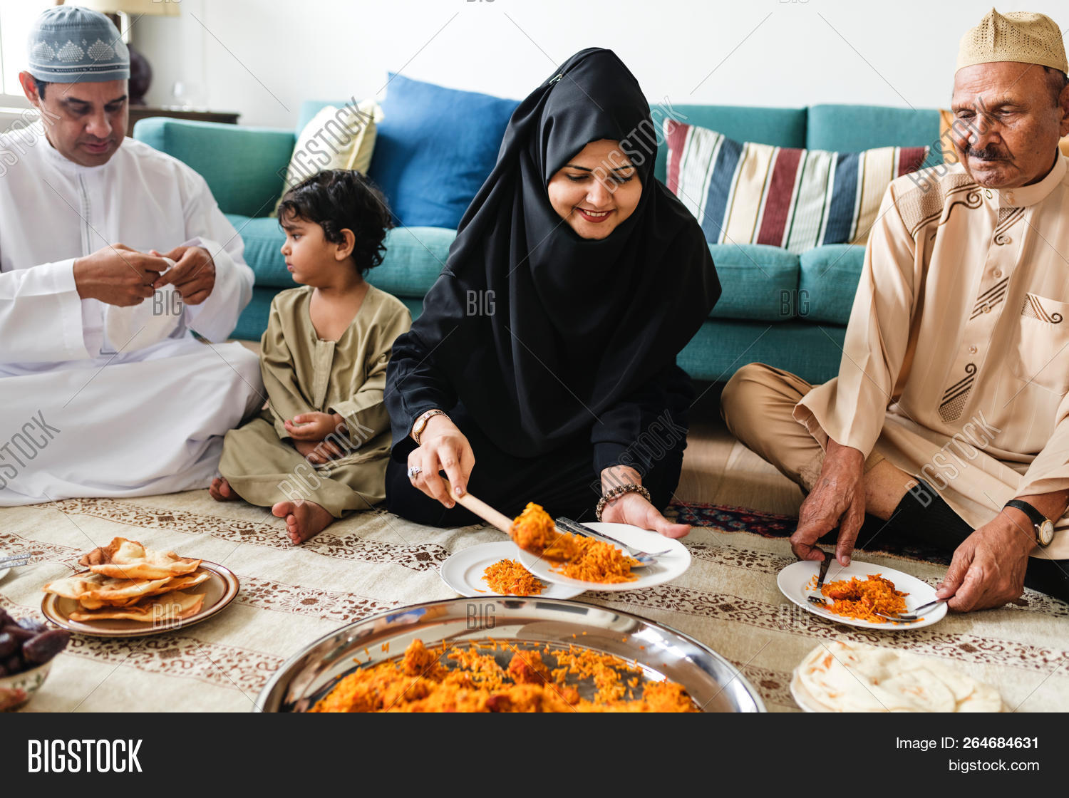 arabic,biryani,cap,celebrating,chicken biryani,clothing,cookery,cuisine,culinary,cultural,culture,dining,dinner,eating,family,feast,feasting,food,fried rice,halal,halal food,hijab,home,homemade,islamic,keffiyeh,kufi cap,love,lunch,meal,men,muslim,on social,on the floor,people,ramadan,recipe,restaurant,rice,scarf,sharing,sitting,table,tasty,together,topi,traditional,various,veil