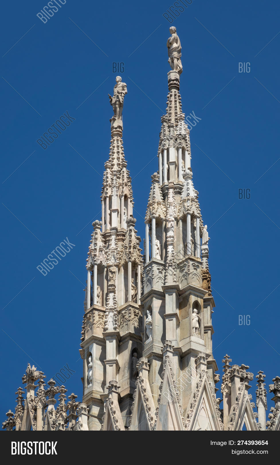 architecture,art,background,beautiful,blue,building,cathedral,catholic,church,city,decoration,di,duomo,europe,european,exterior,famous,gothic,historical,italian,italy,landmark,marble,milan,milano,monument,nobody,old,outdoor,pinnacle,place,religion,religious,roof,sky,spire,statue,statues,stone,temple,top,tourism,tower,travel,white
