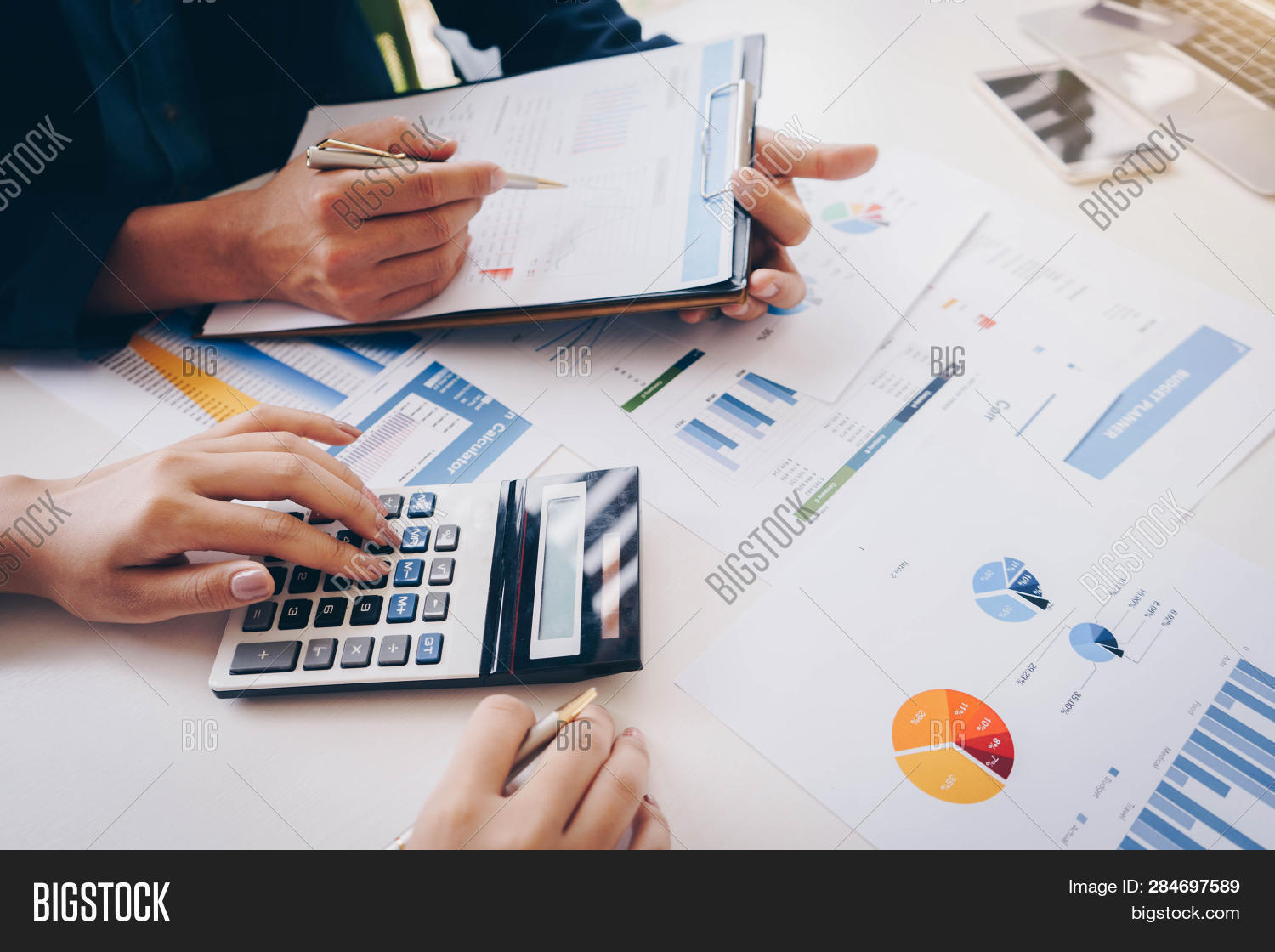 Businesswoman,accountant,accounting,agreement,analysis,analyze,analyzing,brainstorming,budget,business,businessman,calculator,chart,checking,communication,company,concept,consultant,consulting,corporate,cost,data,discussion,document,economy,entrepreneur,explaining,finance,financial,graph,growth,improvement,management,marketing,meeting,office,paperwork,people,plan,planning,project,report,research,sale,service,strategy,team,teamwork,working,workplace