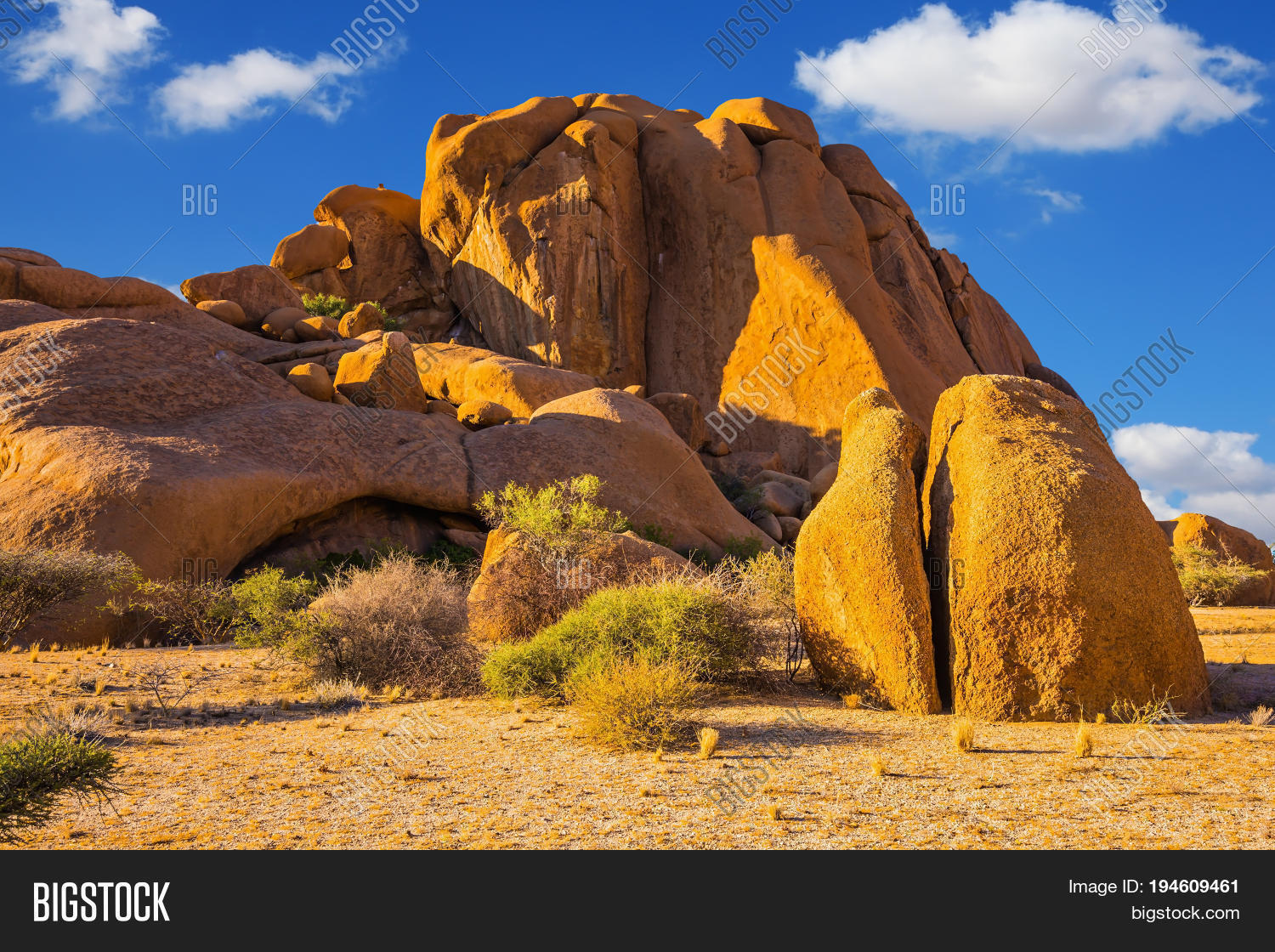africa,arid,array,bald,beauty,boulder,concept,desert,dry,ecological,environment,extreme,formation,geological,granite,landscape,man,mountain,namib,namibia,natural,nature,object,outcrops,outdoors,people,rock,scenic,sky,spitzkoppe,stone,sunlight,terrain,tourism,travel,wilderness