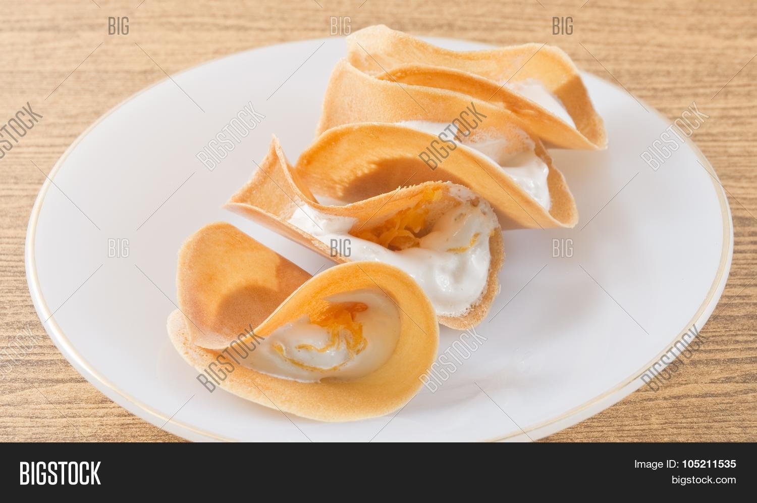 angel,appetizer,appetizing,baked,bakery,beaung,cake,coconut,cream,crepes,crisp,crispy,cuisine,de,dessert,dish,egg,fill,fios,floss,foi,food,fried,golden,gourmet,grilled,hair,ingredient,kanom,khanom,meal,milk,ovos,pancake,pastry,snack,spread,street,strip,stuff,sweet,sweetmeat,tart,thai,thailand,thong,thread,topping,whip,york