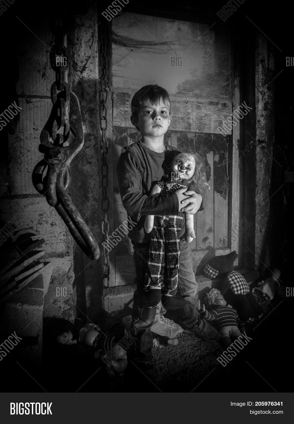barn,bizarre,black,boy,child,childhood,children,clown,crazy,creepy,damaged,dark,dirty,distressed,disturbing,doll,dust,dusty,eerie,evil,face,fear,fright,halloween,haunted,holding,horror,old,plastic,puppet,scary,spider,spiderweb,spooky,toy,vertical,vintage,web,weird,white,window,worn,young