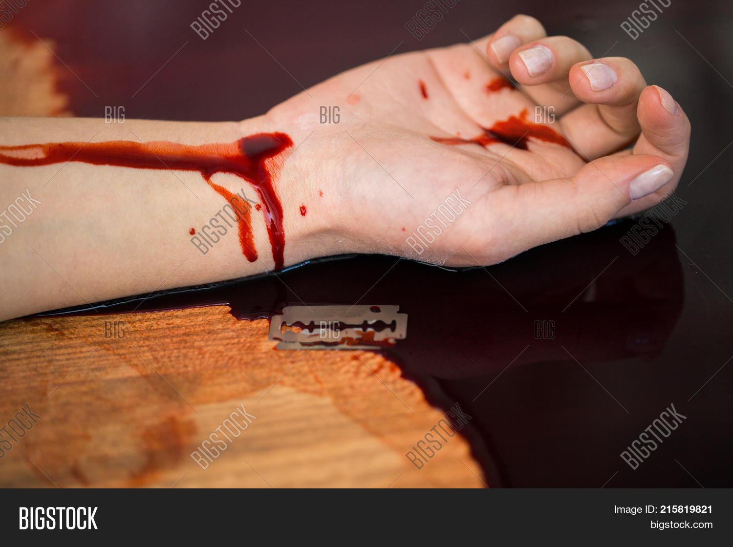 adult,blade,bleeding,blood,body,closeup,concept,corpse,crime,danger,dead,death,die,female,floor,hand,horror,human,indoors,injured,issue,kill,lying,murder,people,person,physical,razor,room,scene,social,suicide,teenage,tragedy,trouble,victim,woman,wounded,young
