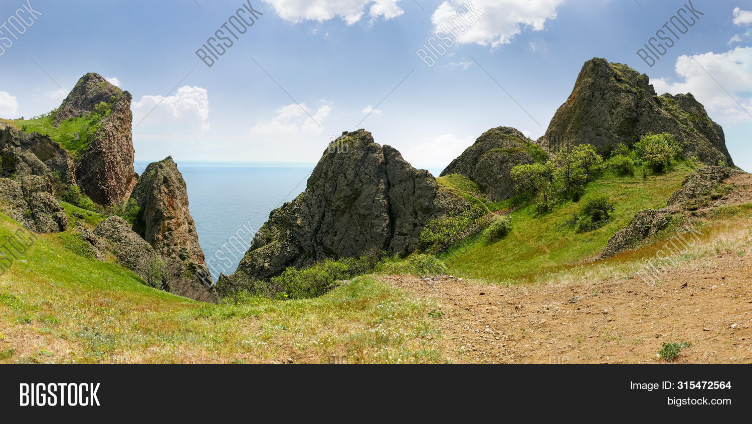 Rocky Ridge With Outcrops Volcanic Origin Above The Sea, Panoramic View ...