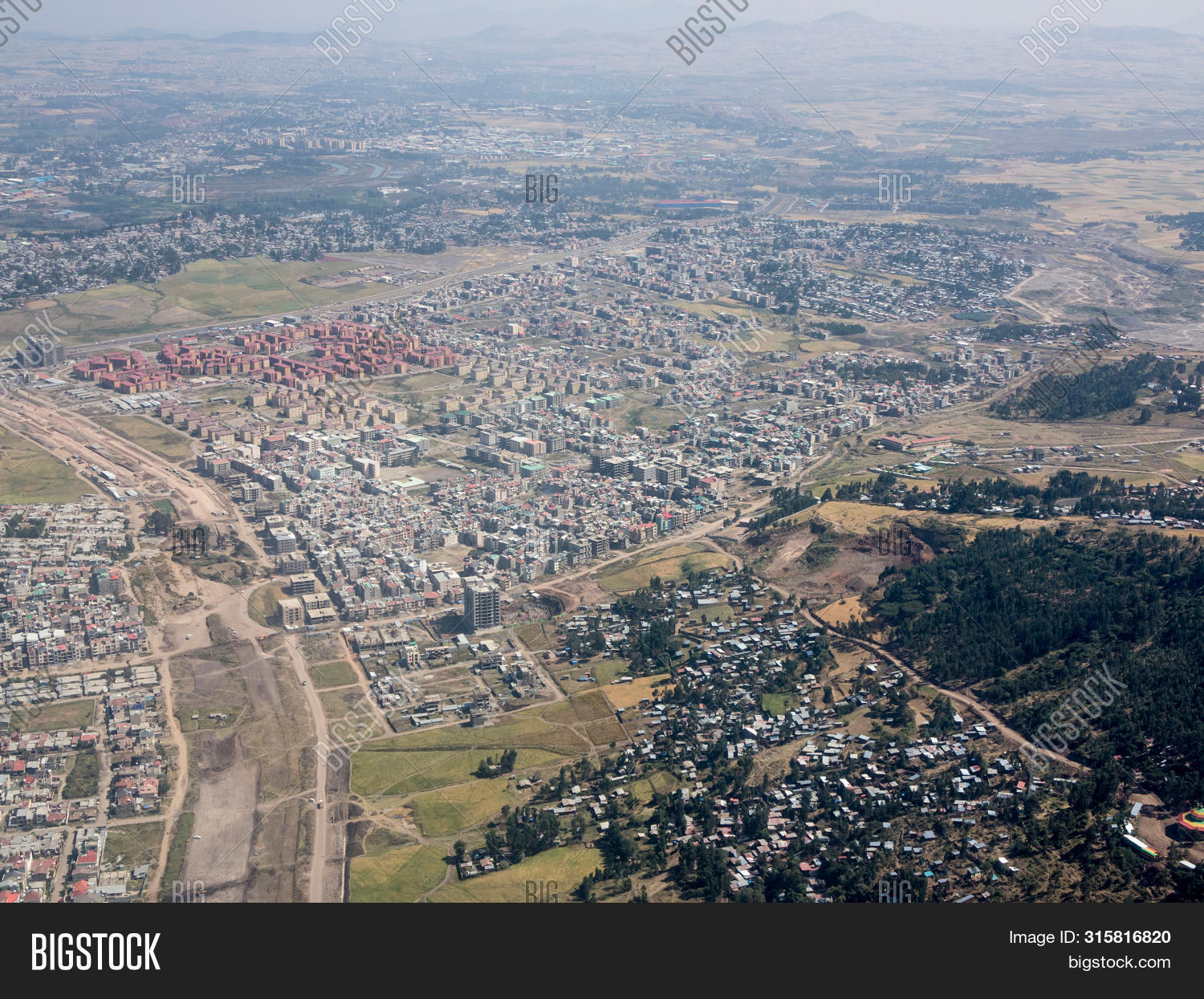 above,addis ababa,aerial,africa,airplane,buildings,capital,city,construction,crowded,development,drone,ethiopia,expansion,landmark,modern,new construction,overhead,population,travel,urban,view