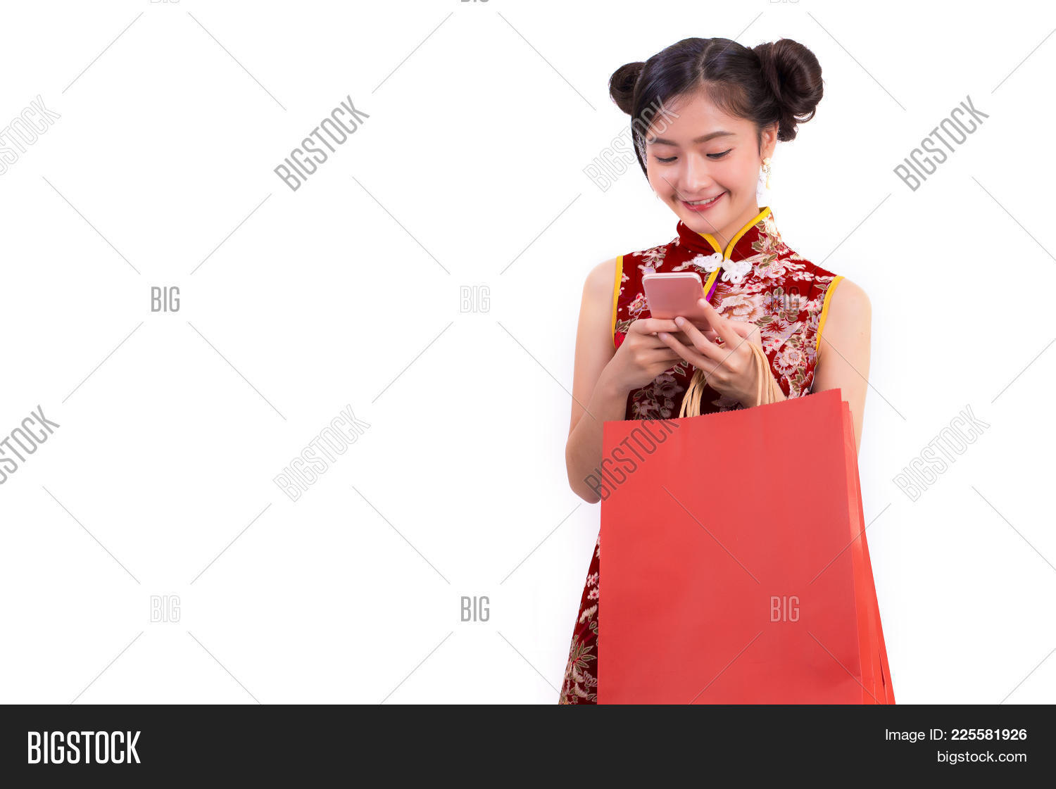 Young Asian Beauty Woman Wearing Cheongsam And Using Smart