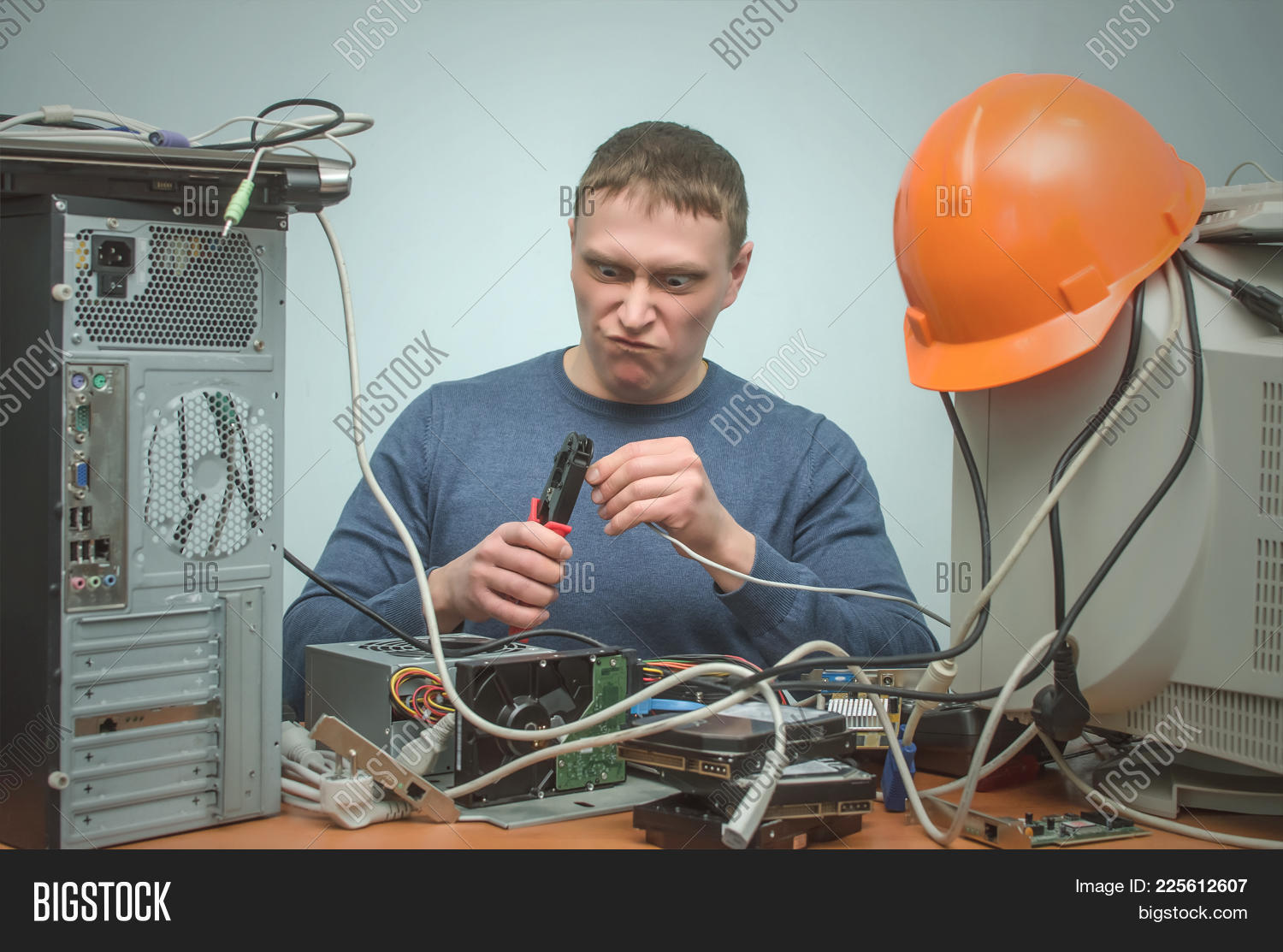 administrator,assistance,background,cable,computer,concept,connection,connector,contact,cord,crazy,crimper,crimping,desk,diagnostics,engineer,fix,funny,hands,help,holding,internet,it,lan,link,maintenance,male,man,master,network,pc,people,person,programmer,repair,repairman,service,sitting,specialist,support,system,technician,testing,tool,use,utp,wan,wire,work,worker