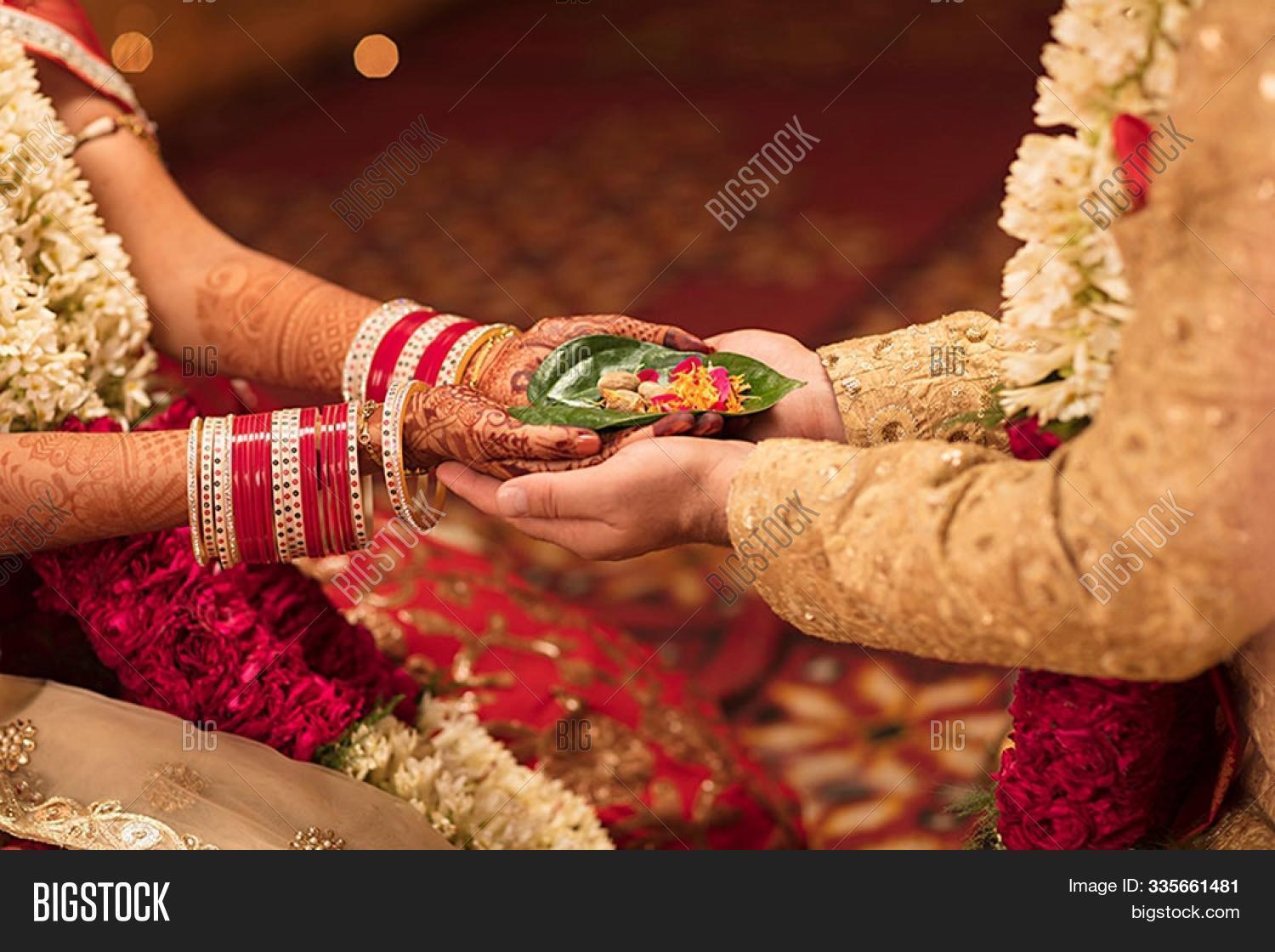 art,asian,background,beautiful,beauty,bride,celebration,couple,culture,decoration,design,female,gold,groom,hand,henna,hindu,holding,india,indian,love,man,marriage,married,red,tattoo,tradition,traditional,wedding,white,woman