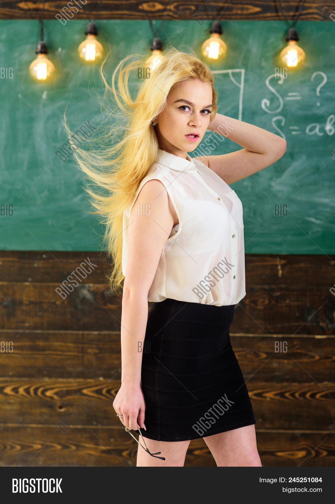adorable,adult,attractive,background,blackboard,blonde,blouse,bulb,calm,caucasian,chalkboard,classroom,college,concept,cute,dreamy,education,elite,face,formal,front,girl,hair,hairstyle,knowledge,lady,learn,light,long,pretty,school,sexi,sexy,smart,stand,strict,student,study,teach,teacher,university,wave,wear,white,woman,youth