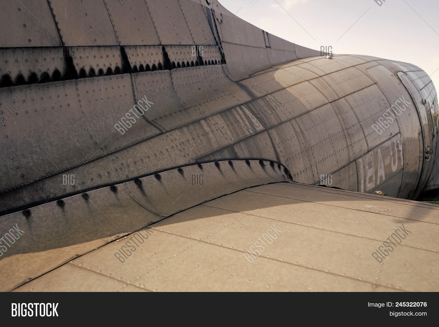 abstract,aerospace,aircraft,airplane,alloy,aluminum,aviation,backdrop,background,bolt,construction,corrosion,detail,fighter,fuselage,graphic,industrial,industry,iron,line,material,metal,metallic,metallized,military,old,overlap,overlay,panel,part,pattern,plane,plate,retro,rivet,riveted,rusty,screw,shape,skin,solid,steel,surface,technology,texture,vehicle,vintage,wing