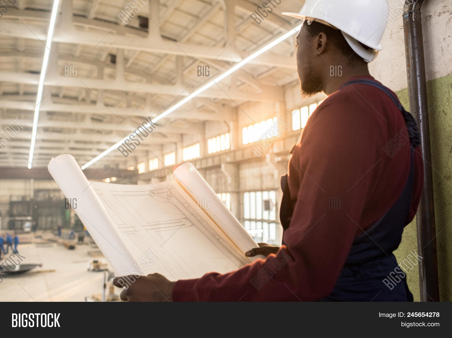 African,American,adult,analyzing,architect,blueprint,building,construction,engineer,expert,factory,foreman,hardhat,helmet,industry,job,looking,man,manager,manual,manufacturing,occupation,pensive,person,plan,plant,professional,project,site,sketch,thoughtful,worker,young