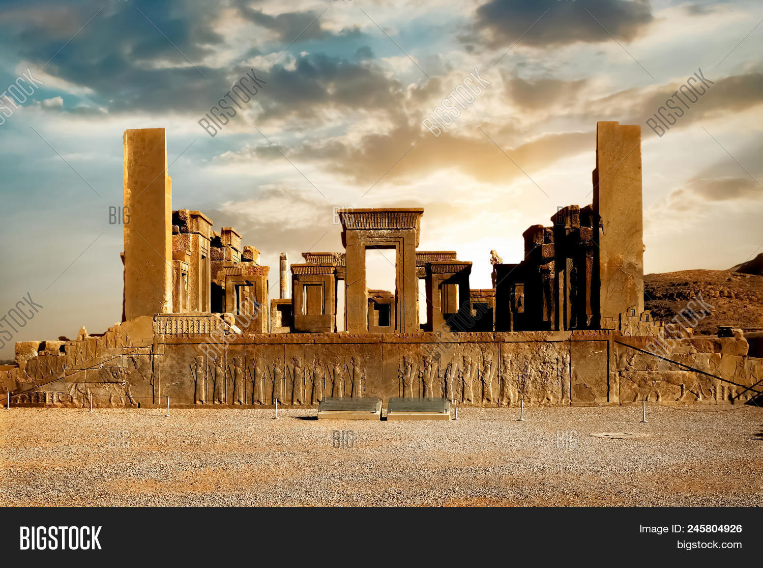 Achaemenid,Iran,Iranian,Persepolis,Persia,Persian,ancient,archeology,bas-relief,blue,capital,clouds,columns,culture,dynasty,east,excavations,heritage,historical,history,middle,monument,nobody,old,outside,palace,relief,ruins,sand,sculpture,shiraz,sight,sky,statue,stone,sun,sunrise,sunset,tourism,travel,unesco,wall,white,world