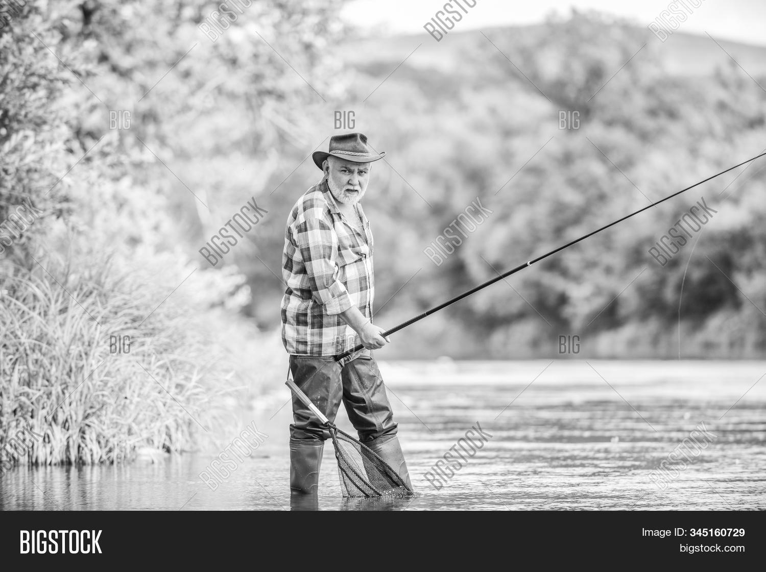 mature,man,retired,fisherman,fishing,rod,summer,weekend,trout,bait,bearded,fisher,hobby,sport,activity,pothunter,catching,fish,fly,river,stream,catch,nature,reel,closeup,animal,outdoor,wild,checkered,poacher,boat,accessories,holiday,poaching,marine,pole,carp,hanging,freshwater,contest,spinner,line,beach,morning,deep,tackling,seafood,aquatic
