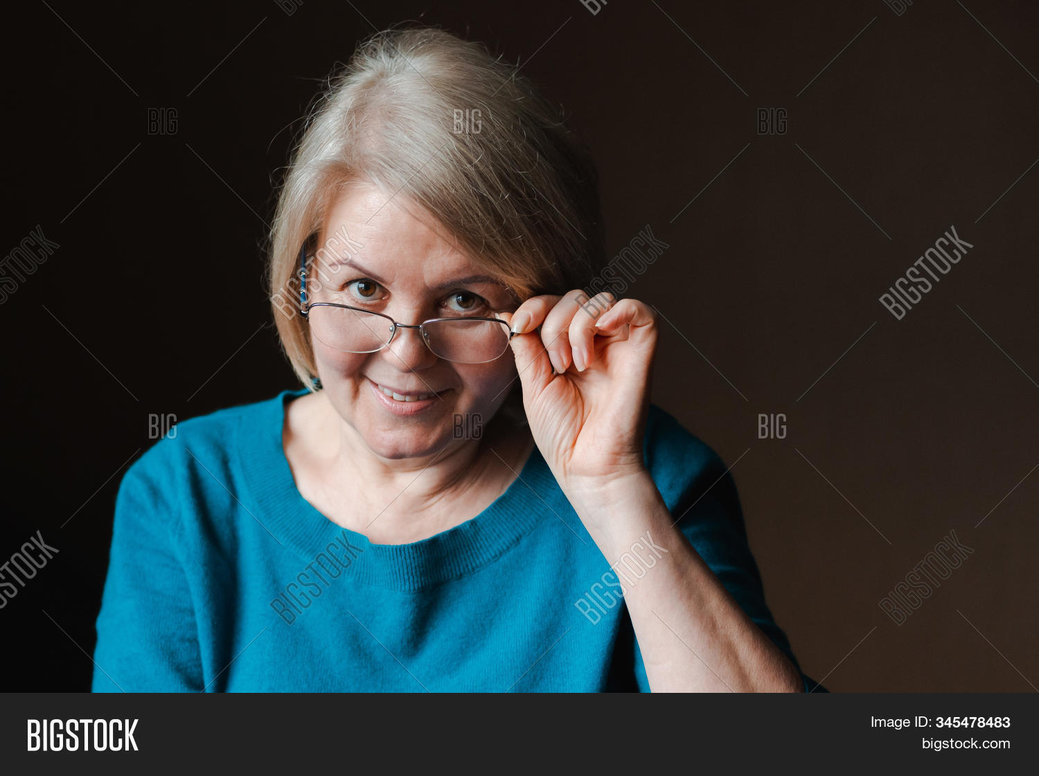 woman,portrait,senior,eyeglasses,lifestyle,caucasian,indoors,home,elderly,retired,people,beautiful,european,1,attractive,eyesight,modern,spectacles,eyewear,smiling,sitting,optical,relaxing,happy,lady,old,female,60,confident,serene,age,older,beauty,mature,enjoy,hair,white,50,adult,bookcase,closeup,happiness,domestic,background,brown