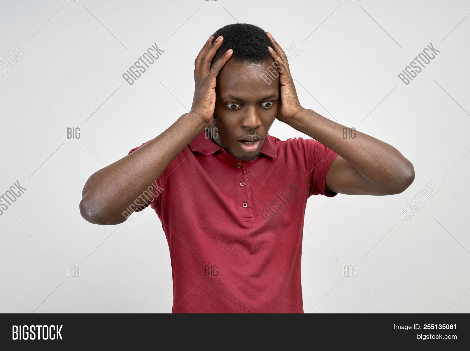 adult,afraid,african,amazed,amazement,american,astonished,attractive,background,black,business,casual,down,downward,emotion,expression,face,facial,fear,grab,guy,handsome,head,hold,isolated,look,looking,male,men,model,mouth,news,one,open,people,person,portrait,scared,scream,shock,stress,student,studio,stunned,surprise,unhappy,white,wow,young