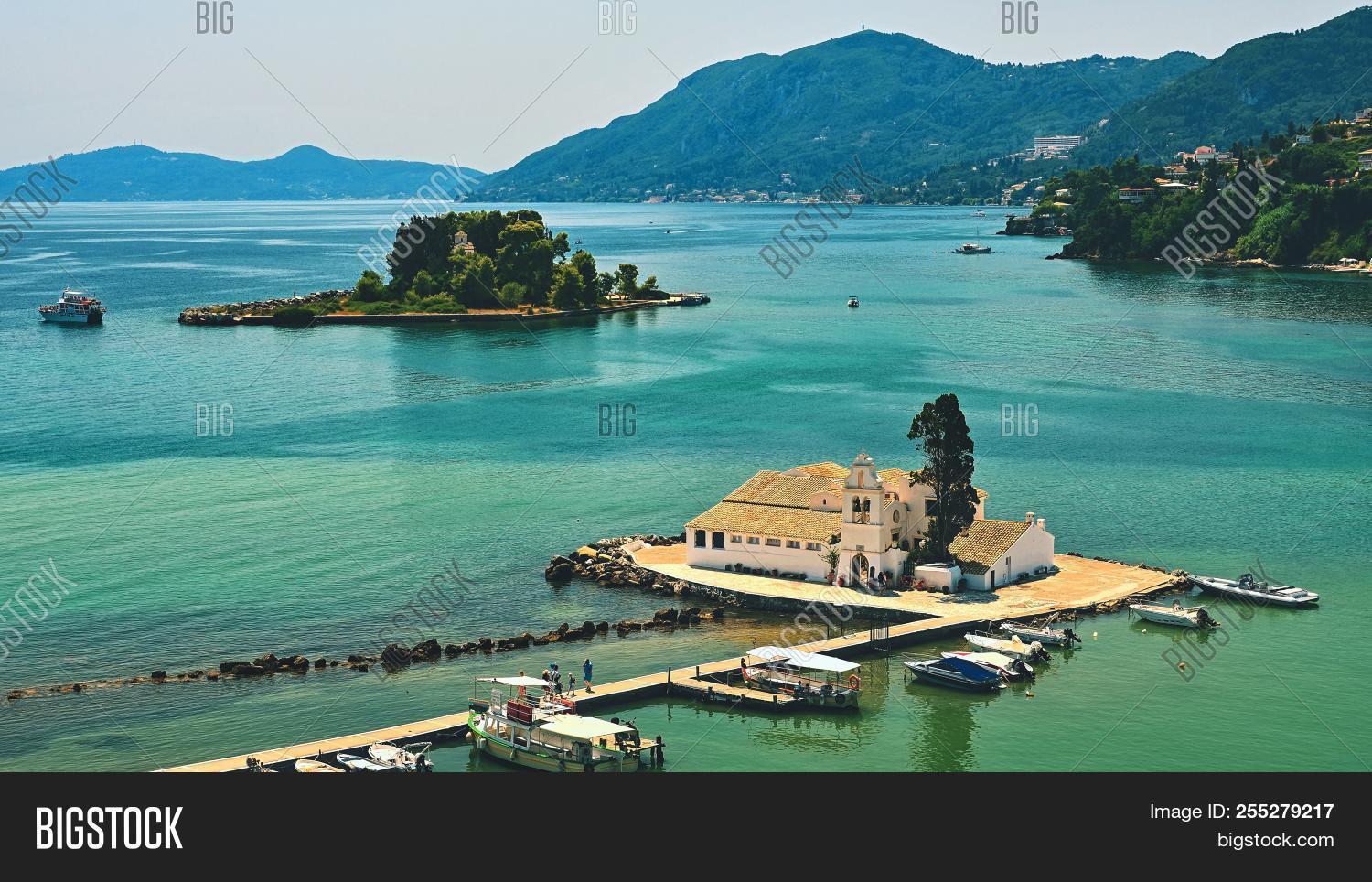 afternoon,architecture,attraction,beautiful,belief,blue,building,cathedral,christianity,church,coast,corfu,day,destinations,famous,greece,greek,helenic,holiday,ionian,island,kanoni,kerkyra,landmark,landscape,mediterranean,monastery,monument,mouse,orthodox,panagia,pontikonisi,religion,scene,sea,sightseeing,summer,sundown,sunlight,sunny,sunset,tour,tourism,tourist,travel,vacations,view,visit,vlacherna,water