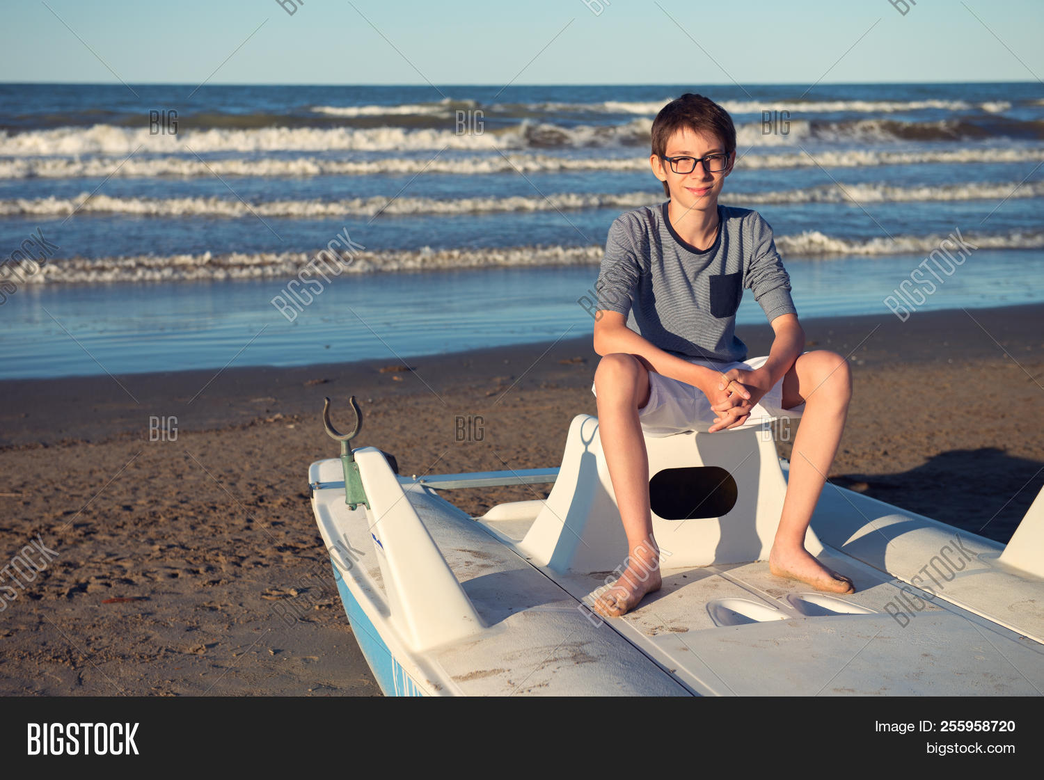 12-13 years old,attractive,beach,blue,boy,catamaran,child,childhood,confident,cute,evening,expressions,eyesight,face,glasses,good mood,guy,handsome,happiness,happy,italian,italy,kid,mediterranean,nature,ocean,one person,outdoor,outside,people,plage,portrait,positive,sea,seaboard,seaside,shore,smiling,summer,teen,teenager,vacations,vision,walking,water,young,youth