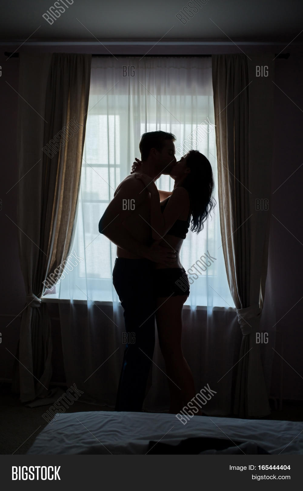 couple,kiss,hug,window,passion,restrain,love,crazy,man,woman,desire,male,sensual,indoor,female,young,sexy,romance,sex,two,passionate,relationship,together,beautiful,beauty,intimate,girl,people,romantic,erotic,boyfriend,girlfriend,lover,satisfaction,heat,home,guy,background,hormone,feeling,dark,curtain,silhouette,priceless,light,stand,side,view,bed,bedroom