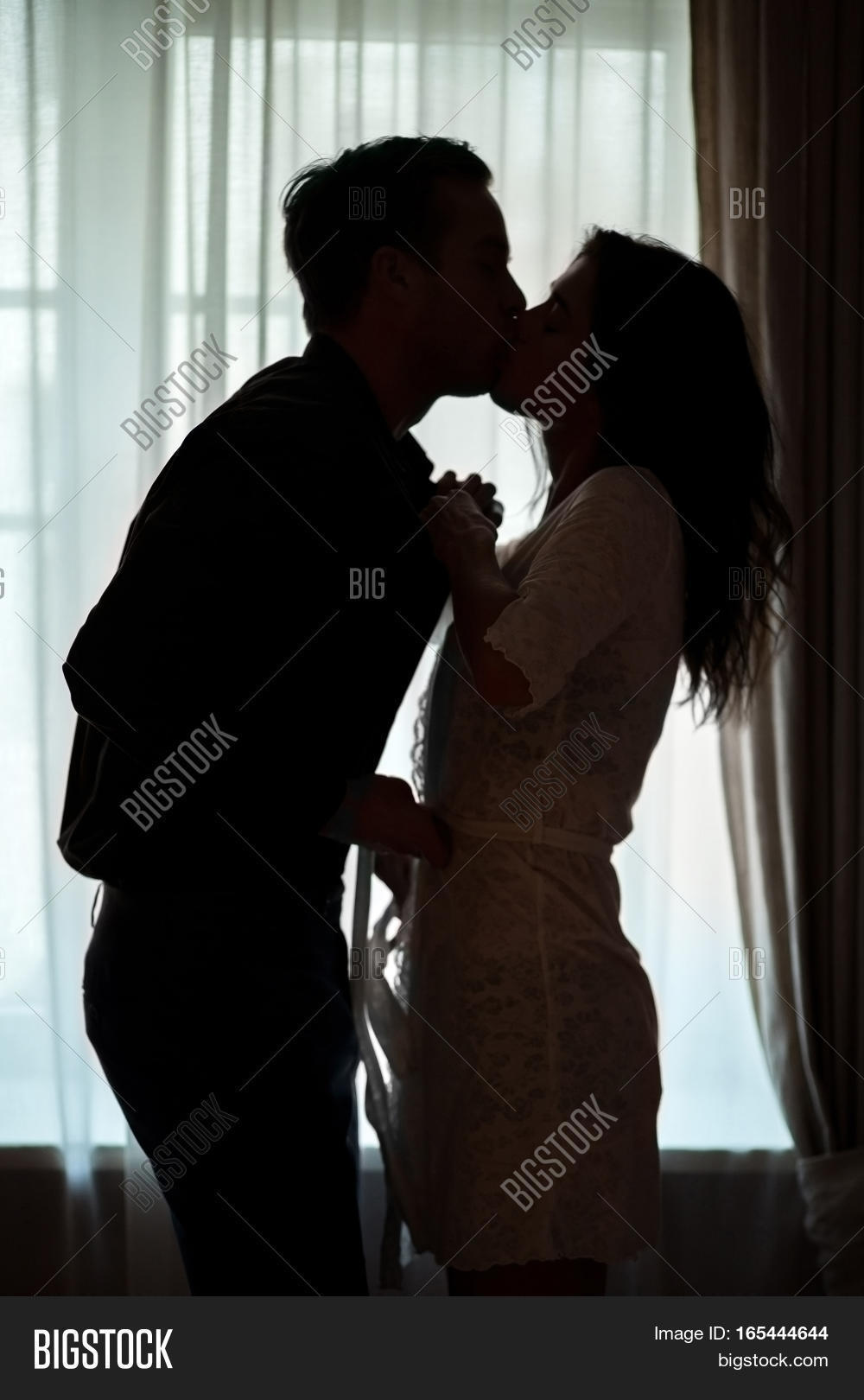couple,kiss,window,undress,passion,fire,love,crazy,man,woman,desire,male,sensual,indoor,female,young,sexy,romance,sex,two,passionate,relationship,together,beautiful,beauty,intimate,girl,people,romantic,boyfriend,girlfriend,lover,satisfaction,heat,home,room,guy,background,hormone,feeling,dark,curtain,silhouette,priceless,light,date,affection,ignite,life,clothes