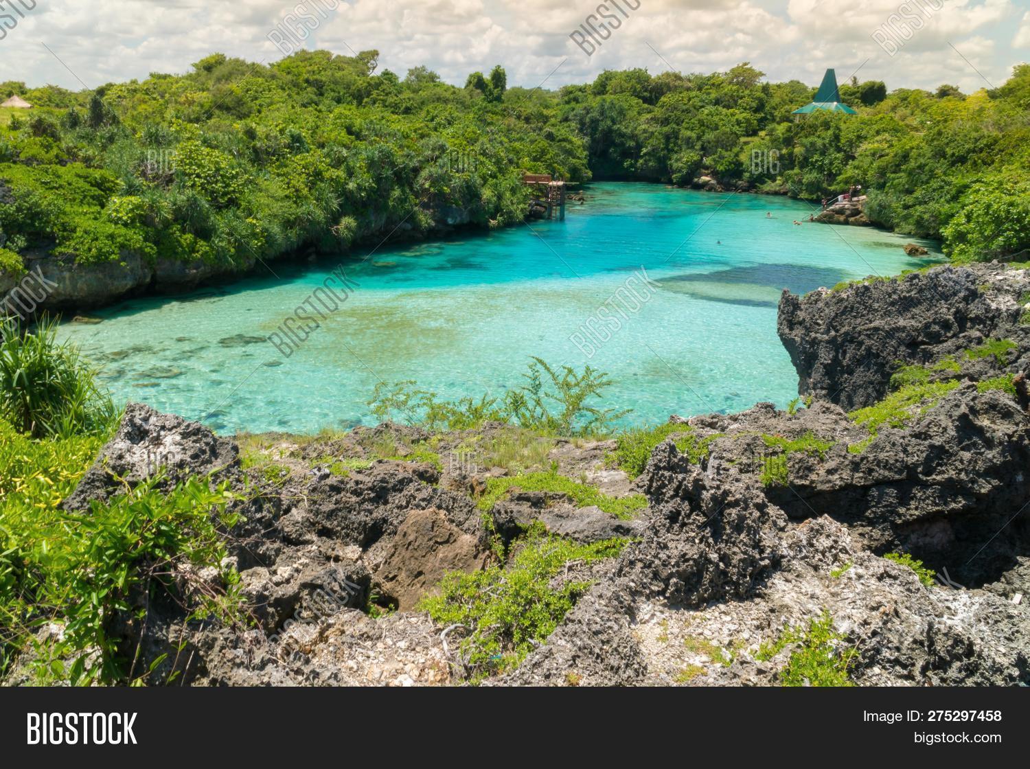 aqua,bay,beach,beautiful,beauty,blue,caribbean,clean,clear,cloud,cloudscape,cloudy,coast,dream,environment,island,landscape,natural,nature,ocean,paradise,reflection,rock,romantic,scene,sea,seascape,shore,sky,sunlight,sunny,sunshine,surf,surface,tourism,tranquil,transparent,travel,tropical,vacation,view,water,wave,wind
