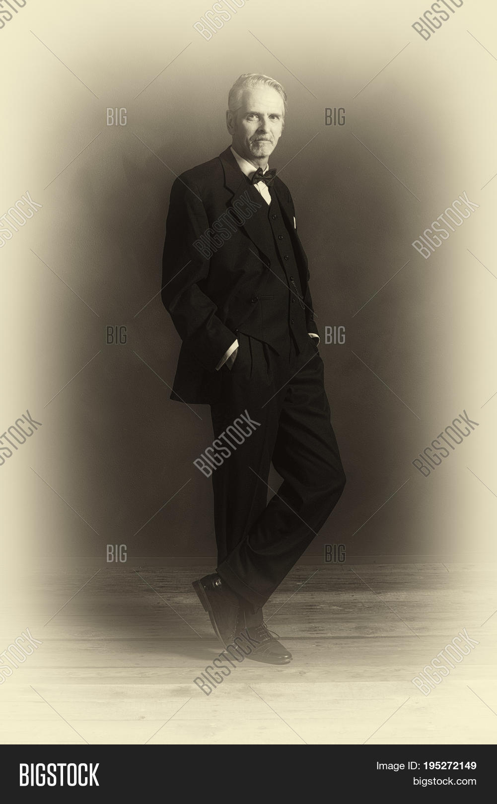 1920s,20s,adult,aged,antique,beard,black,boss,business,businessman,classic,confident,dandy,elegant,fashion,fashioned,finance,floor,goatee,grey,handsome,lifestyle,luxury,man,middle,money,nostalgic,old,people,person,photo,photography,plate,power,retro,room,shirt,standing,style,success,successful,suit,tie,vintage,wall,white,wood