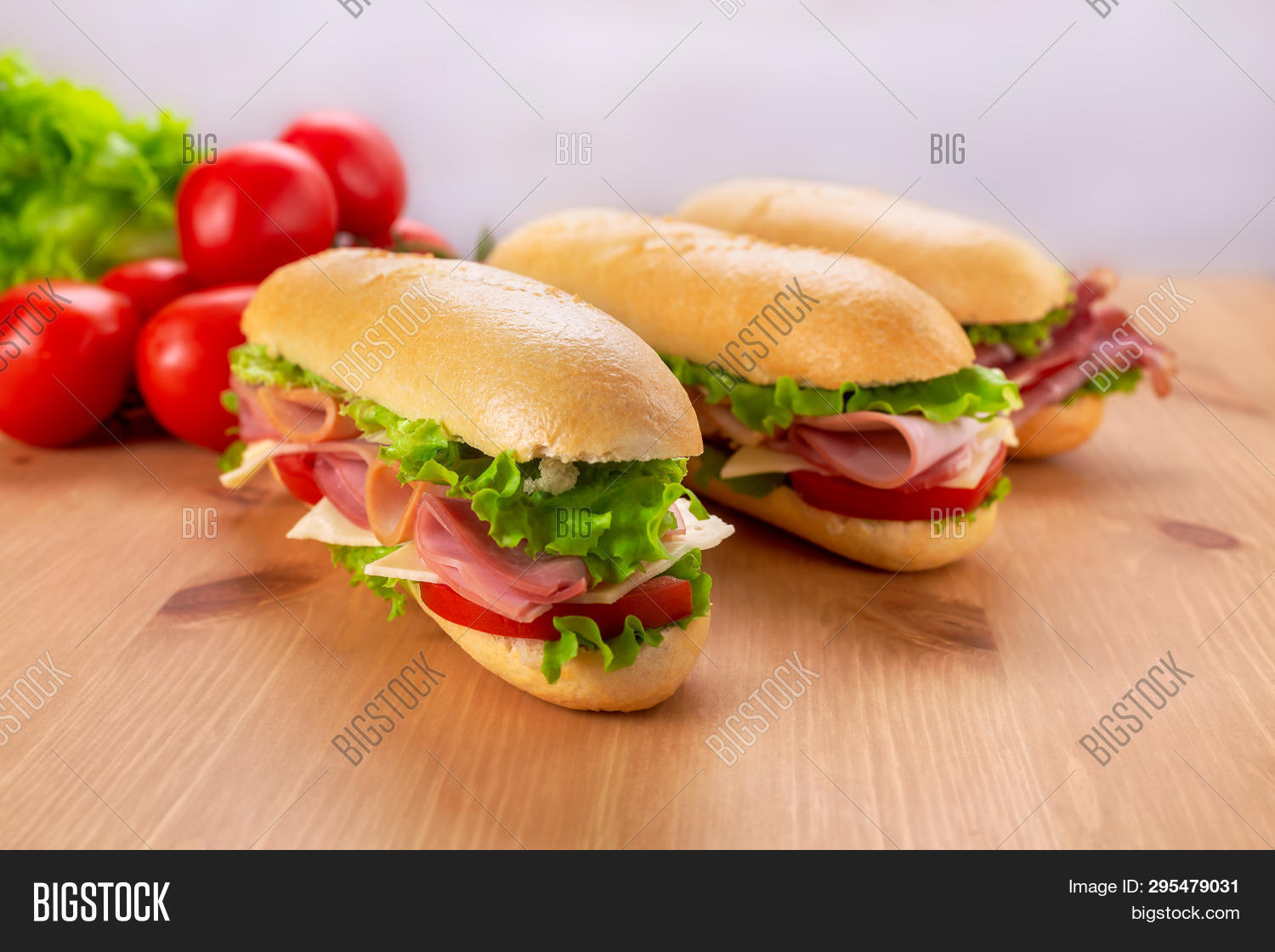 3,american,assorted,baguette,big,bread,cheese,cold,cooked,cooking,cut,deli,delicatessen,dinner,fast,food,fresh,green,ham,healthy,lettuce,lunch,meal,meat,peperoni,piece,pork,prosciutto,red,rolled,salami,sandwich,slice,snack,stuffed,sub,sub sandwich,submarine,subway,table,takeaway,takeout,tasty,three,tomato,traditional,two,vegetable,white,wooden table