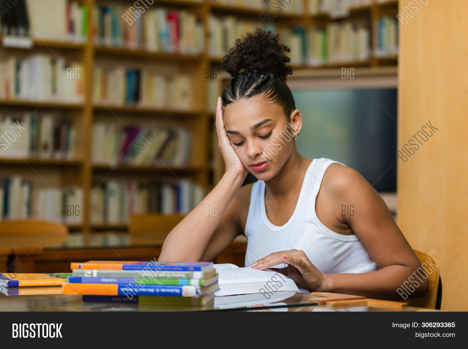 Black,People,academic,adult,african,afro,american,book,brazilian,campus,casual,certification,college,degree,education,ethnic,ethnicity,exams,female,girl,happy,holding,indoors,learning,librarian,library,looking,modern,person,phd,portrait,read,reading,school,south,student,study,studying,teen,teenager,test,trainee,training,uni,university,woman,young