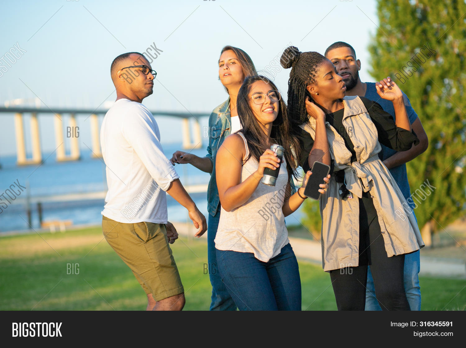african, 																					amused, 																					bearded, 																					black, 																					caucasian, 																					cheerful, 																					company, 																					concept, 																					dancing, 																					dreadlock, 																					dress, 																					effect, 																					emotion, 																					eyeglasses, 																					friend, 																					hand, 																					happy, 																					holding, 																					lady, 																					leisure, 																					life, 																					listening, 																					man, 																					music, 																					nature, 																					park, 																					party, 																					people, 																					posing, 																					race, 																					relaxation, 																					relaxed, 																					season, 																					smartphone, 																					smiling, 																					spending, 																					summer, 																					sunny, 																					sunrise, 																					time, 																					together, 																					walkway, 																					weather, 																					woman, 																					young