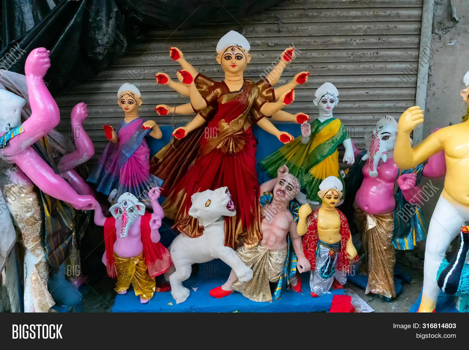 Durga,Ganesh,Ganesha,Puja,art,calcutta,clay,coating,color,colour,colourful,craft,craftsmanship,creative,culture,deity,divine,female,festival,god,goddess,hindu,hinduism,holy,idol,incarnation,india,indian,kartik,kolkata,kumartuli,kumortuli,ladies,laxmi,made,material,of,paint,preparation,production,religion,religious,ritual,saraswati,sculpture,spiritual,statue,tradition,women,worship
