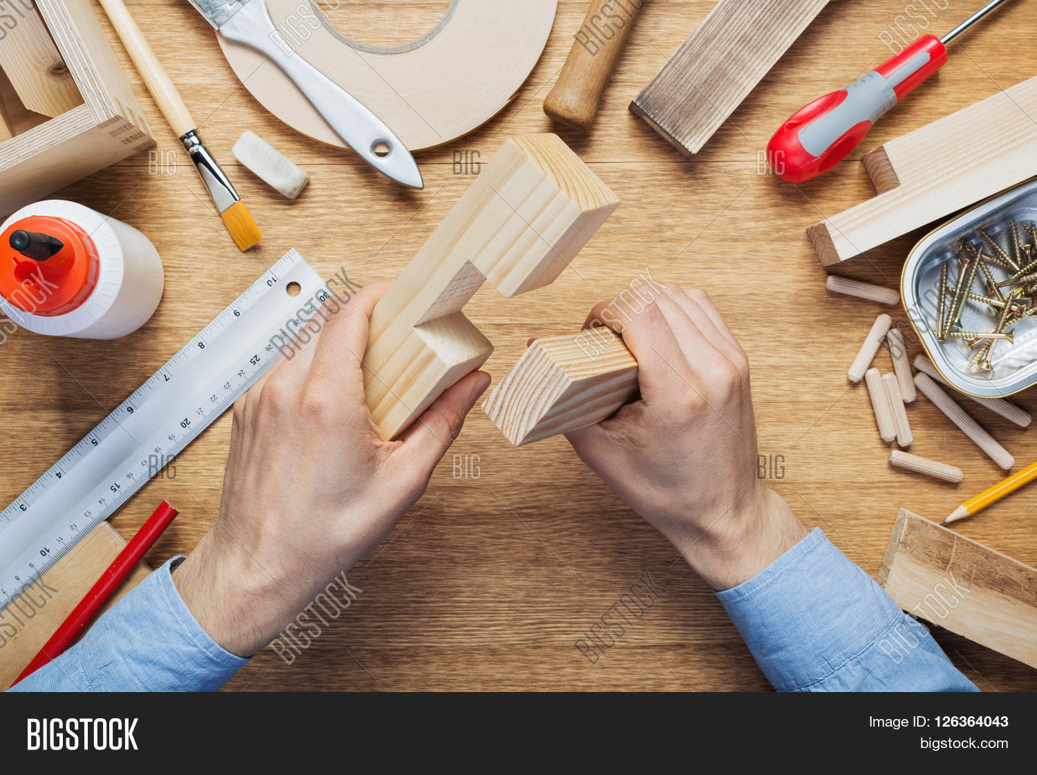 arm,background,board,box,build,carpenter,carpentry,craft,craftsman,create,desk,diy,flat,frame,furniture,glue,hammer,hand,handyman,hardware,joinery,joint,lap,lay,lumber,make,male,man,manual,modeling,mortise,people,project,repair,table,tabletop,tenon,timber,tool,top,wood,wooden,woodwork,woodworker,woodworking,work,workbench,worker,workplace,workshop