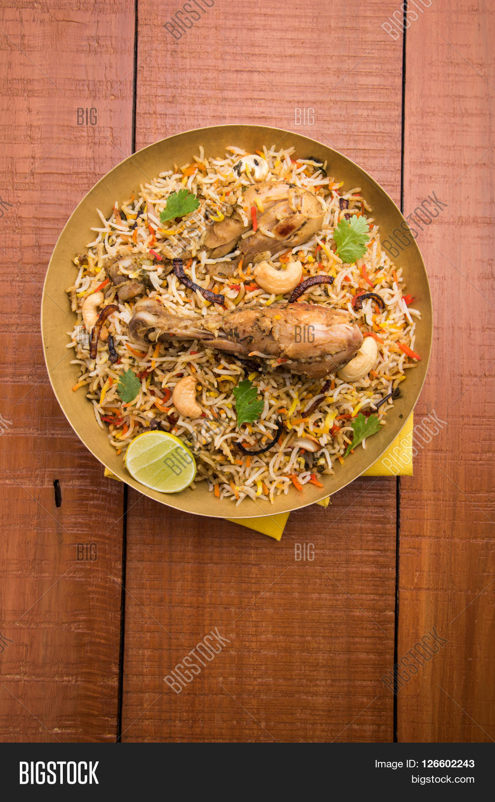 biryani,chicken,indian,food,arabian,india,grain,dish,stick,meal,lemon,fried,pilaf,steamed,traditional,pakistani,dinner,leg,basmati,piece,pakistan,garnishing,rice,boiled,party,non,hot,vegetarian,masala,eid,delicious,bowl,ramadan,bombay,restaurant,spices,lunch,pulao,cooked,sela,halal,veg,spicy,brass,asian,meat,diwali,iftar,hydrabadi