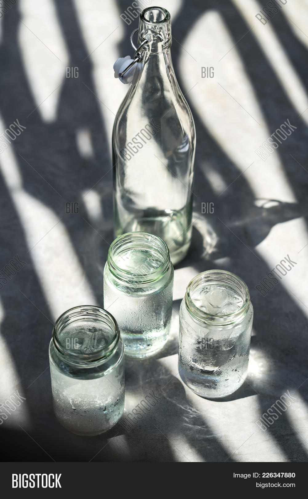 appetizing,bottle,break,bung,cafe,close-up,closeup,cube,daylight,delicious,drink,energy,glass,ice,jar,nice,plug,restaurant,shadow,sunlight,sunny,table,tasty,water,yummy