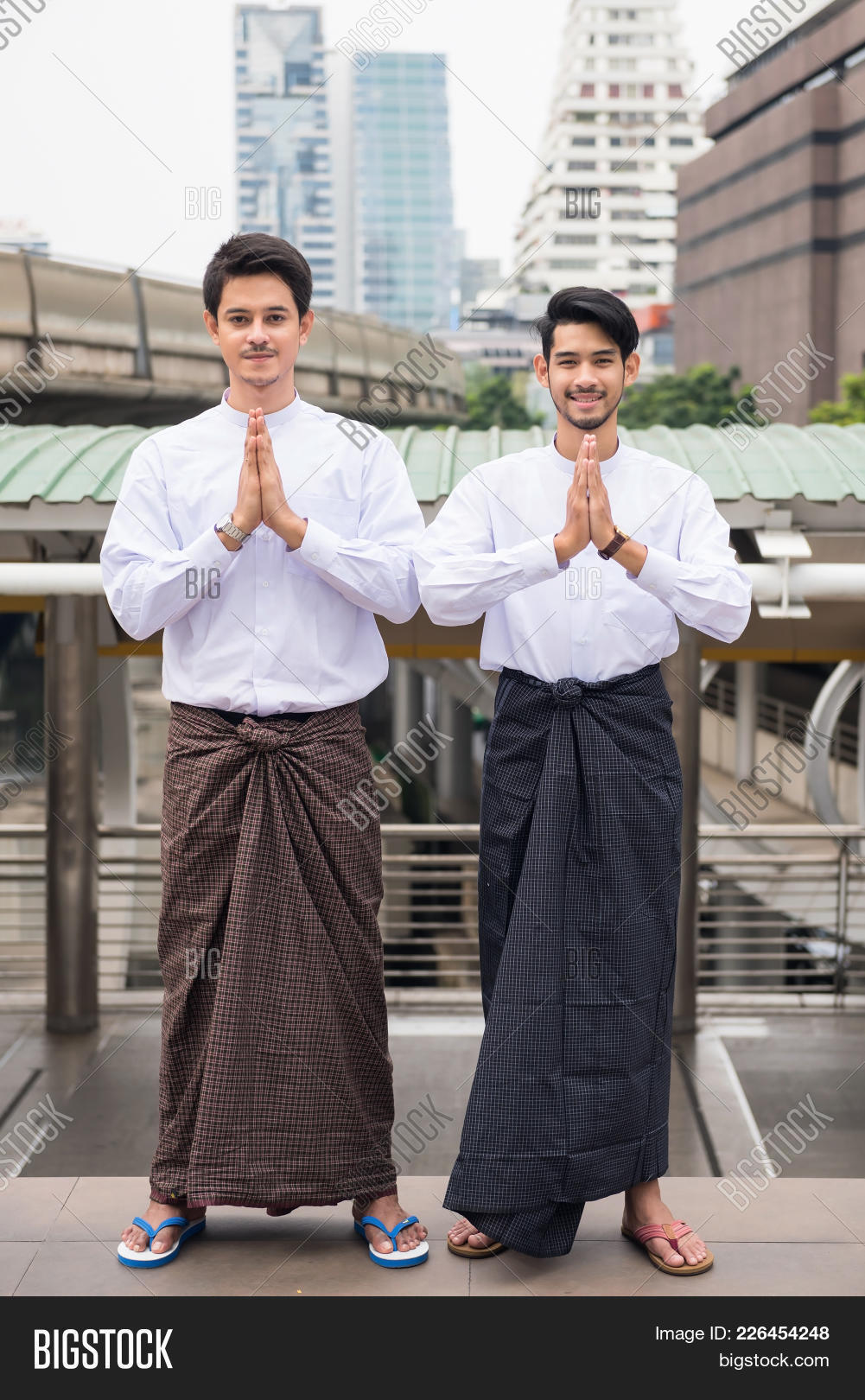 adult,arab,architecture,asia,asian,bearded,bridge,building,burmese,business,businessman,city,clock,communication,connection,conversation,delight,dress,face,fintech,friend.,gesture,hair,hands,handsome,happy,holding,indian,longyi,male,man,modern,myanmar,one,outdoor,person,portrait,salute,smart,technology,telephone,traditional,urban,young