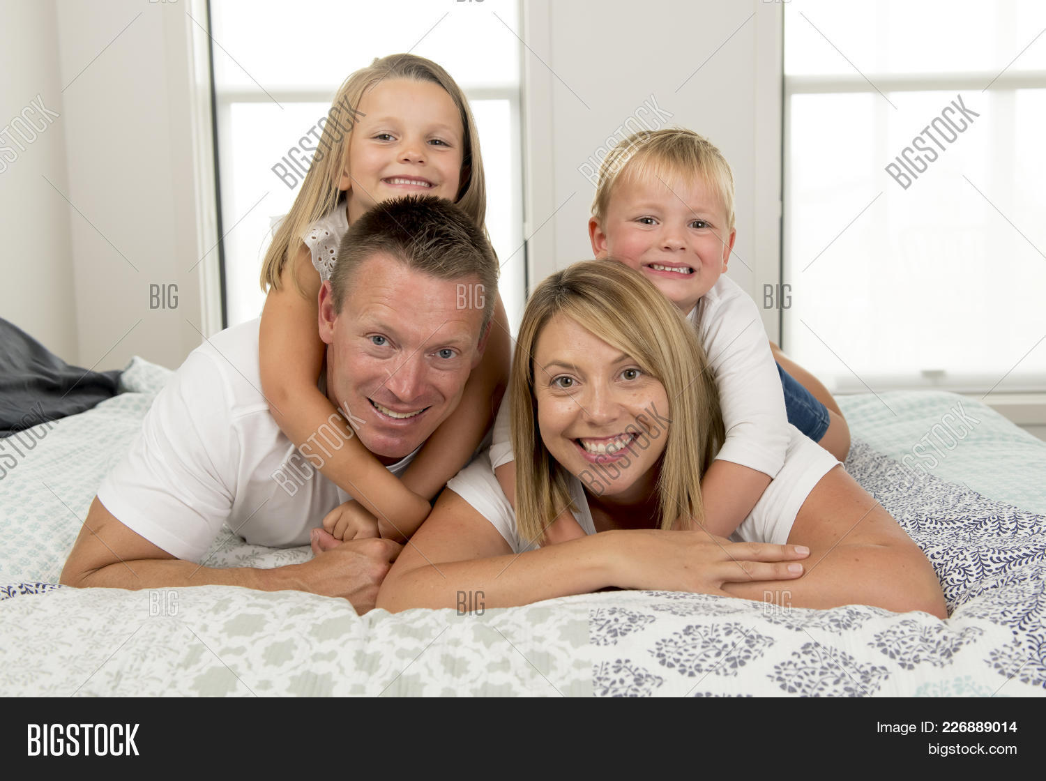 30s,40s,American,Caucasian,attractive,beautiful,bed,bedroom,blond,boy,cheerful,children,couple,daughter,family,father,fun,girl,handsome,happiness,happy,husband,life,lifestyle,little,looking,love,lying,man,married,morning,mother,old,parents,playful,portrait,posing,pretty,radiant,romantic,sibings,small,smiling,son,sweetness,together,wife,woman,years,young