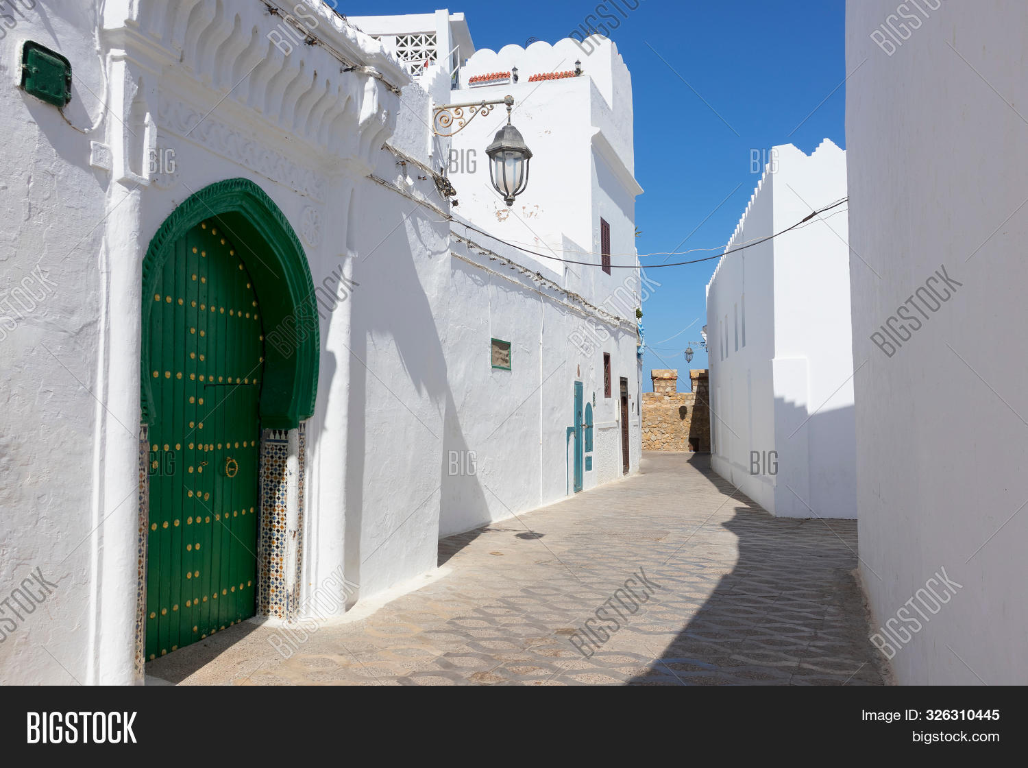 alley,ancient,arabic,architecture,arzeila,asilah,assilah,building,culture,decoration,design,door,entrance,exterior,front,history,house,medina,morocco,narrow,no people,north africa,old,outdoor,rampart,shape,street,tourism,tradition,traditional,village,white