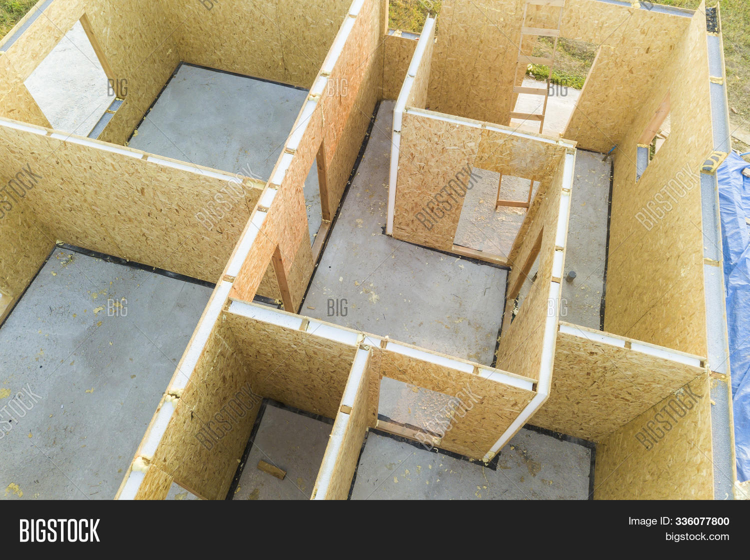 aerial,architecture,assembling,board,building,carpentry,construction,conventional,detail,development,ecology,efficient,energy,engineering,exterior,family,frame,home,house,housing,incomplete,industry,insulation,lumber,making,modern,modular,montage,new,osb,panel,part,plywood,prefabricated,residential,section,sip,site,structure,technology,timber,top,unfinished,wall,wood,wooden,work