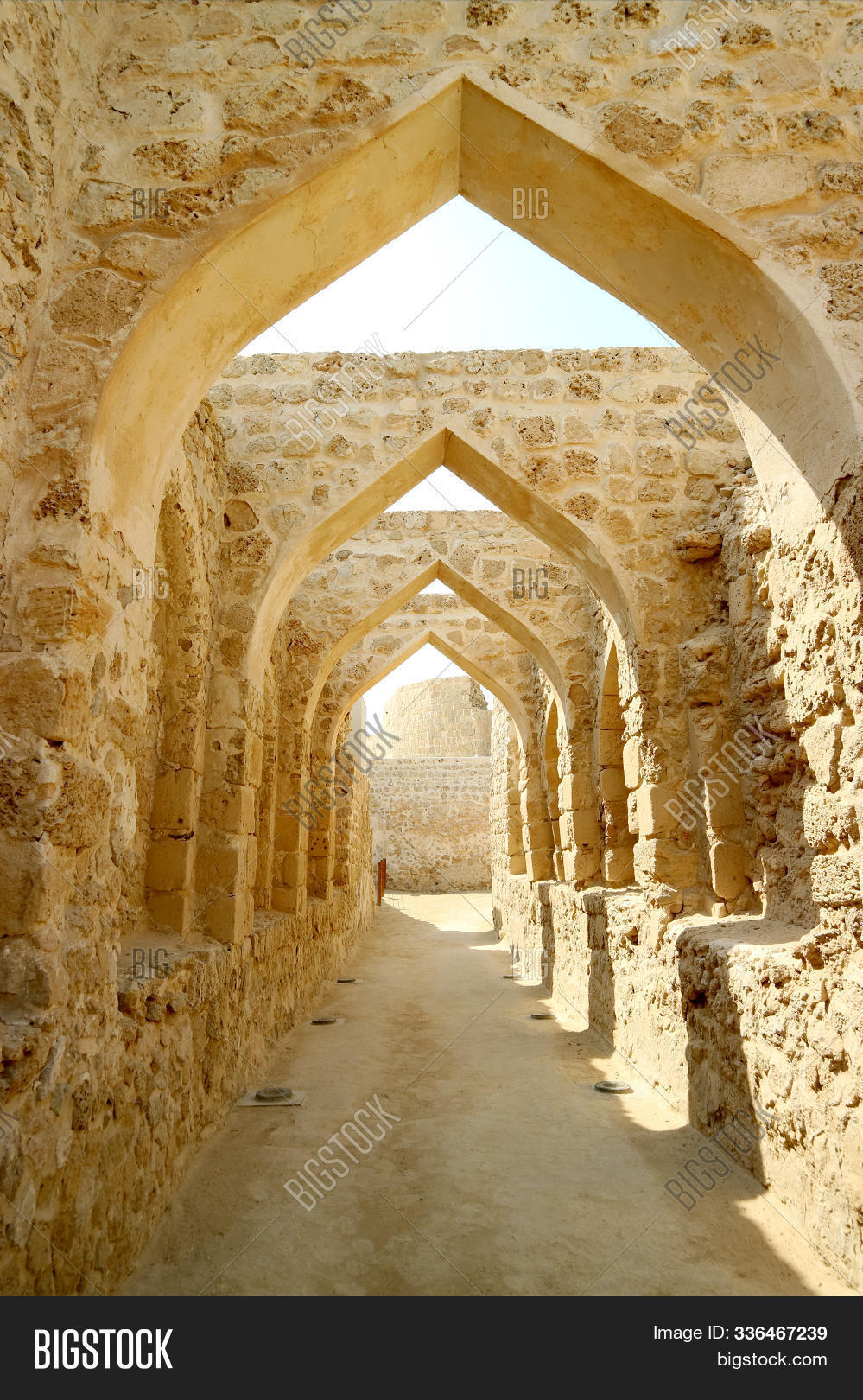 al-bahrain,ancient,arch,archaeological,architecture,archway,asia,bahrain,civilization,coastal,corridor,daytime,dilmun,fort,fortress,gulf,heritage,historic,holiday,image,impressive,leisure,manama,medieval,middle-east,monument,old,outdoor,persian,portuguese,qal'at,remains,ruins,scenic,seashore,sightseeing,site,sky,stone,structure,stunning,sunlight,sunny,tourism,travel,unesco,vacation,vertical,world