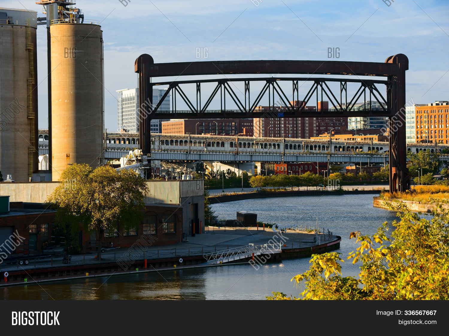 America,Cleveland,Cuyahoga,Ohio,USA,architecture,bridge,buildings,city,cityscape,concrete,construction,evening,exterior,flow,foundry,golden,gritty,highway,historic,hour,industry,infrastructure,lift,old,outdoor,port,railroad,river,shadow,sign,silos,steel,stream,transportation,trees,urban,water