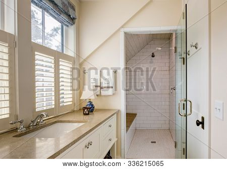 Bathroom interior with beautiful tile wheelchair accessible shower.