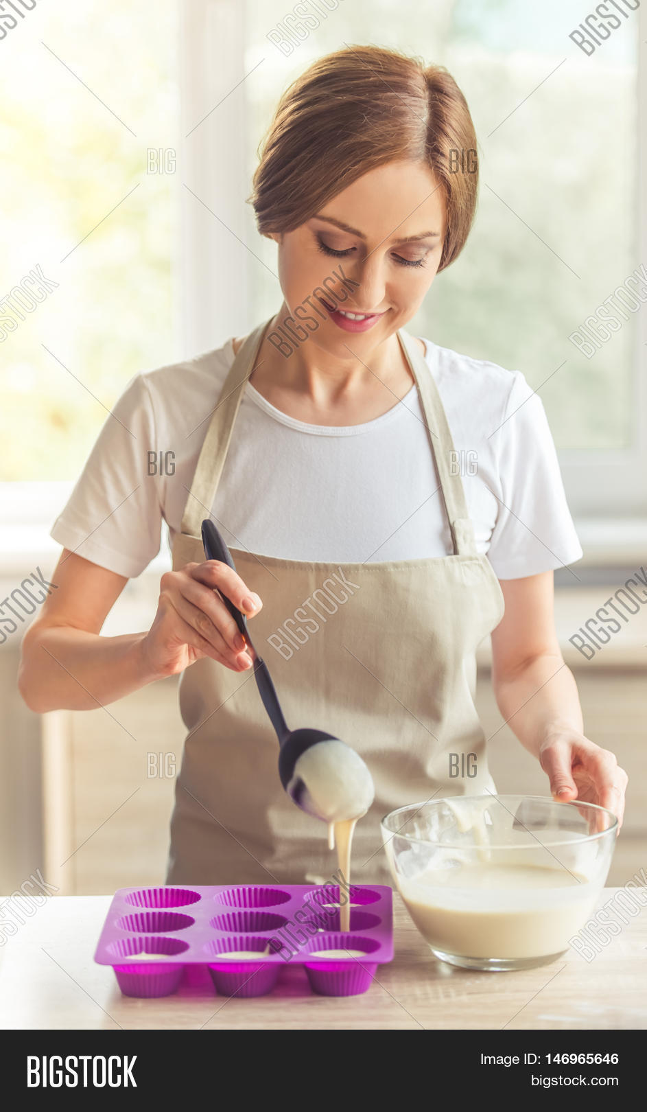 add,adult,apron,baking,beautiful,biscuit,bowl,cake,care,case,caucasian,cook,cookie,cutters,daughter,dough,eggs,female,fill,flour,food,girl,happy,help,home,kitchen,knead,lady,leisure,liquid,look,milk,mix,mom,mother,muffin,one,people,pour,recipe,smile,sugar,sweet,table,tin,woman,work,young