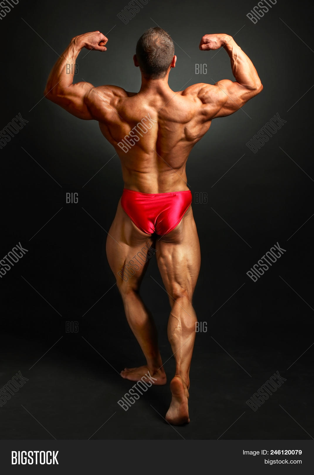 Young Bodybuilder Man Flexing Back Double Bicpes Pose Showing His Huge Trapezius Rhomboid Levator Image Stock Photo 246120079