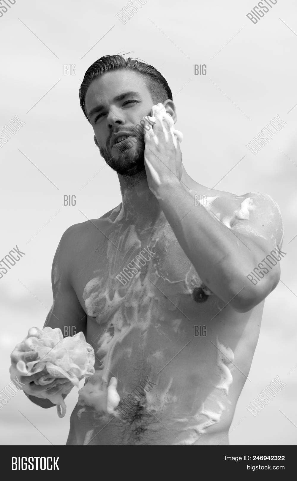 ab,abdomen,athlete,background,beard,blue,body,bristle,caucasian,chest,clear,concentrated,concept,cover,covered,erotic,face,fit,fitness,foam,guy,handsome,health,hot,intimate,light,macho,male,man,masculine,muscle,naked,sex,sexy,sixpack,sky,soap,sponge,sport,sporty,strong,torso,unshaved,waist,wash,washing,weather,young