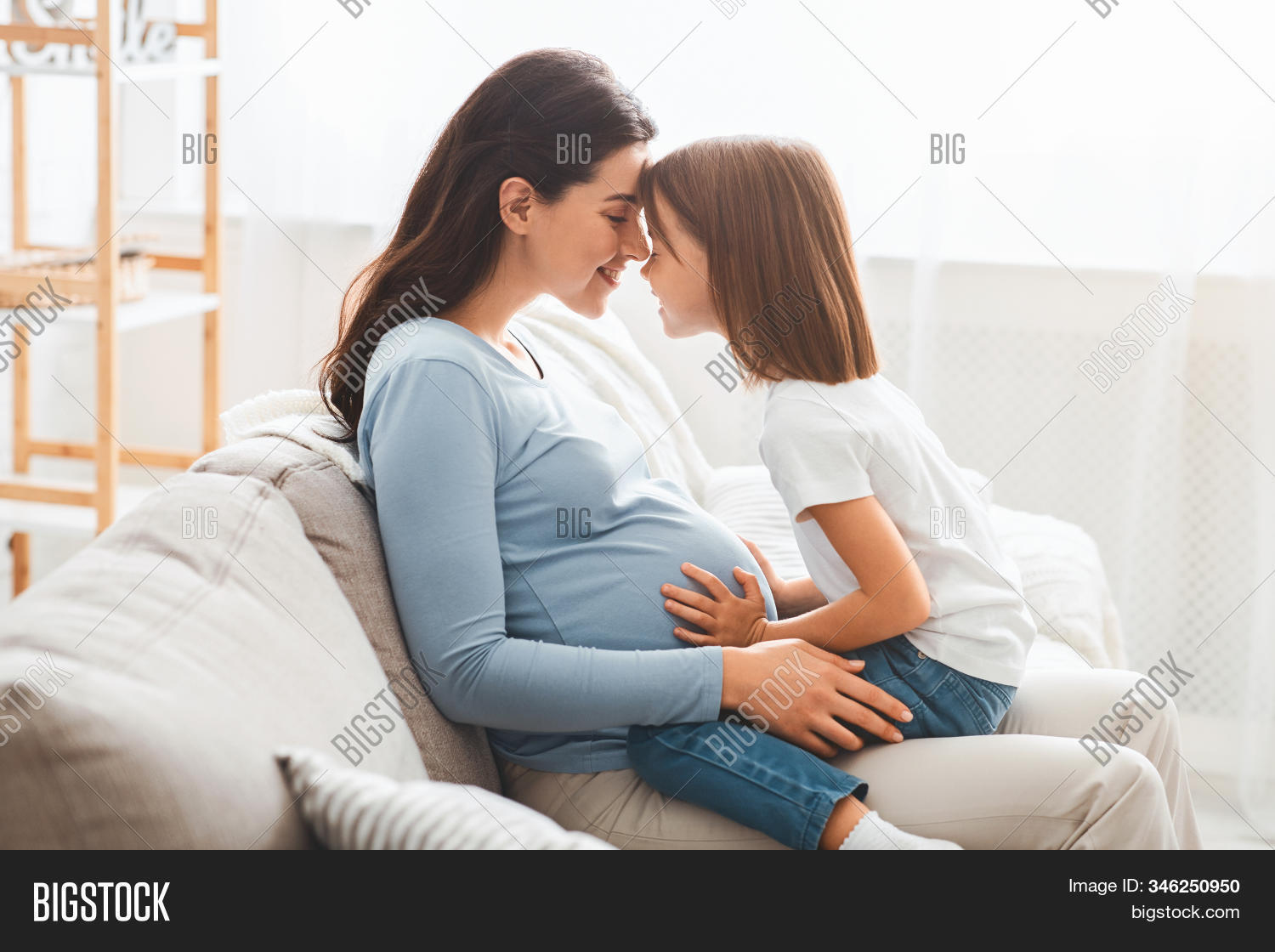 bonding,pregnancy,tummy,happiness,adult,daughter,sister,mom,adorable,new,family,beautiful,parenthood,joyful,expecting,caucasian,care,love,young,home,motherhood,sofa,little,parent,hugging,belly,smile,people,pregnant,fun,child,maternity,affectionate,woman,childhood,birth,two,female,girl,happy,connection,cheerful,mother,support,embracing,trust