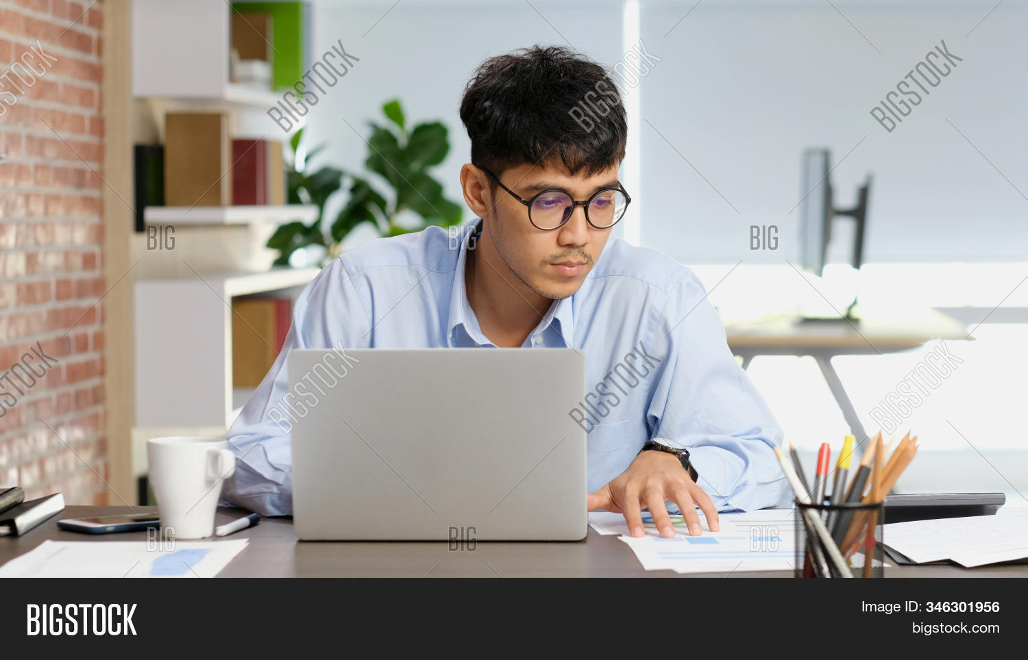 asian,man,laptop,businessman,concentrate,focus,working,computer,business,office,ceo,contemplate,attention,looking,papers,suit,adult,technology,manager,leader,professional,reading,information,report,communication,internet,online,portrait,asia,person,young,people,male,using,sitting,contract,one,eyeglasses,serious,thinking,small,sme,modern