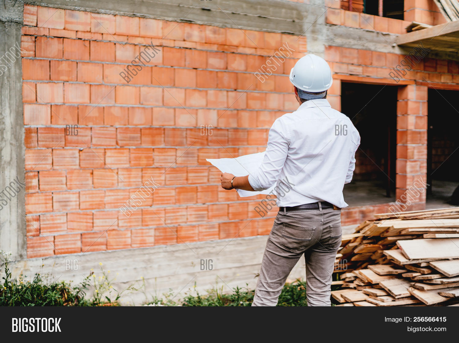 architect,architectural,architecture,blueprints,brick,builder,building,checking,civil,concrete,construction,contractor,development,engineer,engineering,estate,gear,hardhat,helmet,house,industry,infrastructure,inspection,man,manager,mason,masonry,monitoring,paper,plans,project,protection,real,reinforcements,safety,site,smart,smiling,supervisor,technology,verifying,wall,worker,working,workplace,young