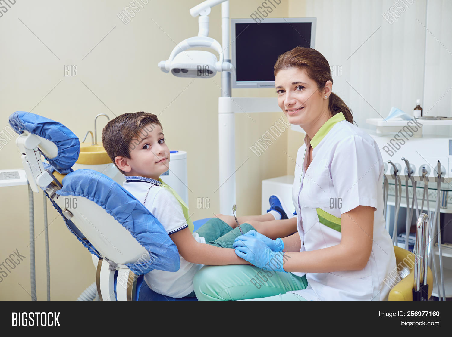 adult,appointment,bib,boy,care,caucasian,chair,checkup,cheerful,child,children,clinic,cute,day,dental,dentist,dentistry,doctor,equipment,examination,expertise,female,gloves,happy,healthcare,hygiene,indoors,job,kid,mask,medicine,nurse,occupation,patient,pediatric,profession,professional,smiling,sterile,stomatology,surgery,surgical,teeth,tool,treatment,view,wearing,woman,young