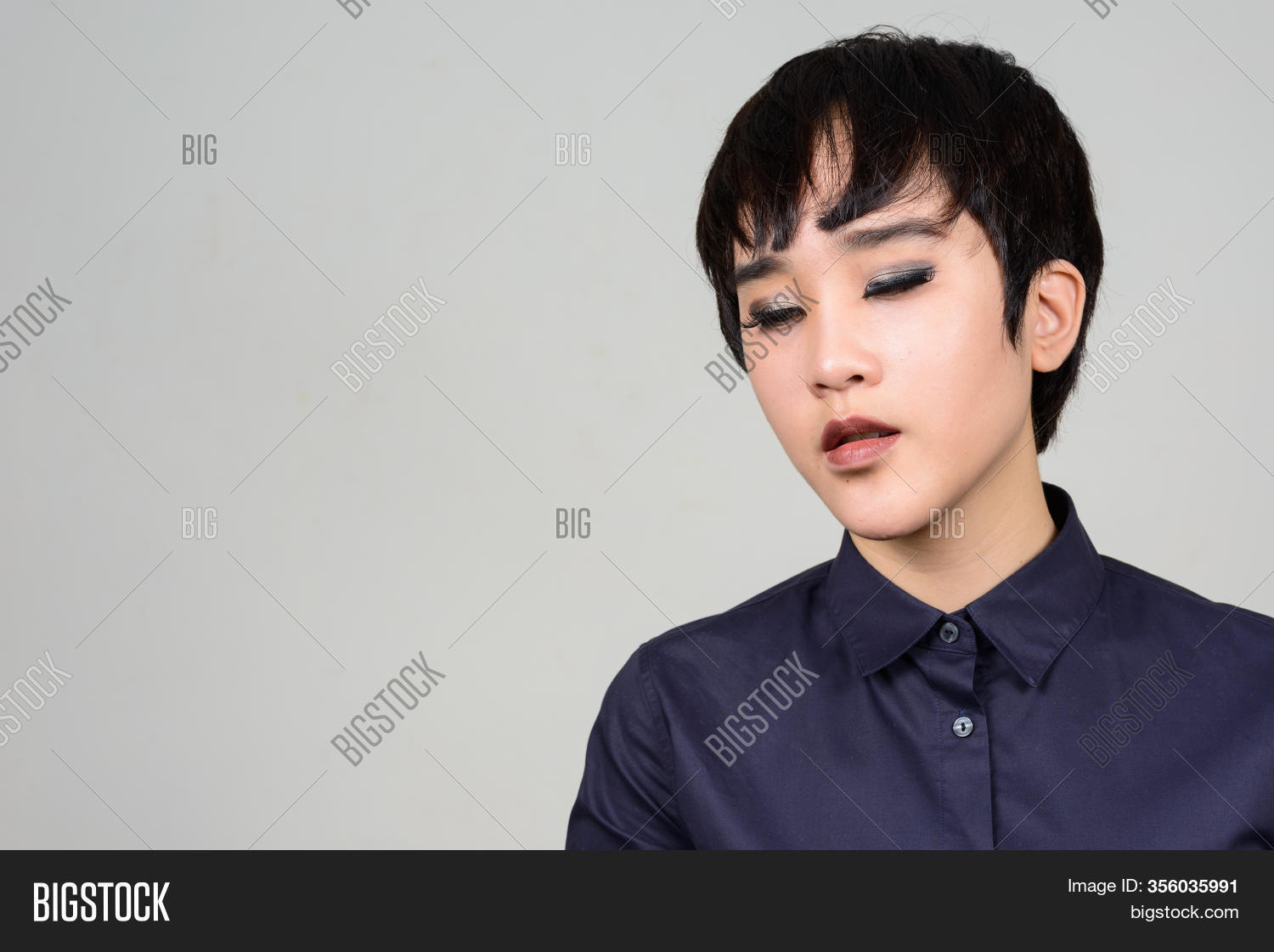 woman, 																					asian, 																					transgender, 																					people, 																					portrait, 																					thai, 																					southeast, 																					20s, 																					female, 																					women, 																					person, 																					young, 																					adult, 																					gay, 																					homosexual, 																					lgbt, 																					transsexual, 																					lesbian, 																					beautiful, 																					handsome, 																					attractive, 																					androgynous, 																					short, 																					hair, 																					closeup, 																					head, 																					face, 																					smart, 																					casual, 																					studio, 																					shot, 																					isolated, 																					white, 																					background, 																					drag, 																					fashion, 																					individuality, 																					nonbinary, 																					think, 																					thinking, 																					looking, 																					down, 																					sad, 																					stressed, 																					serious, 																					worried, 																					problems